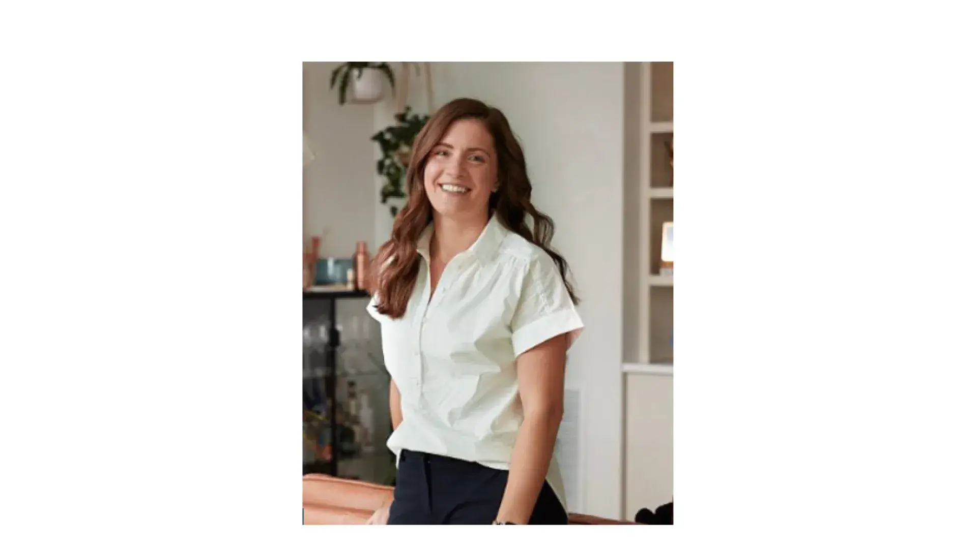 woman poses and smiles