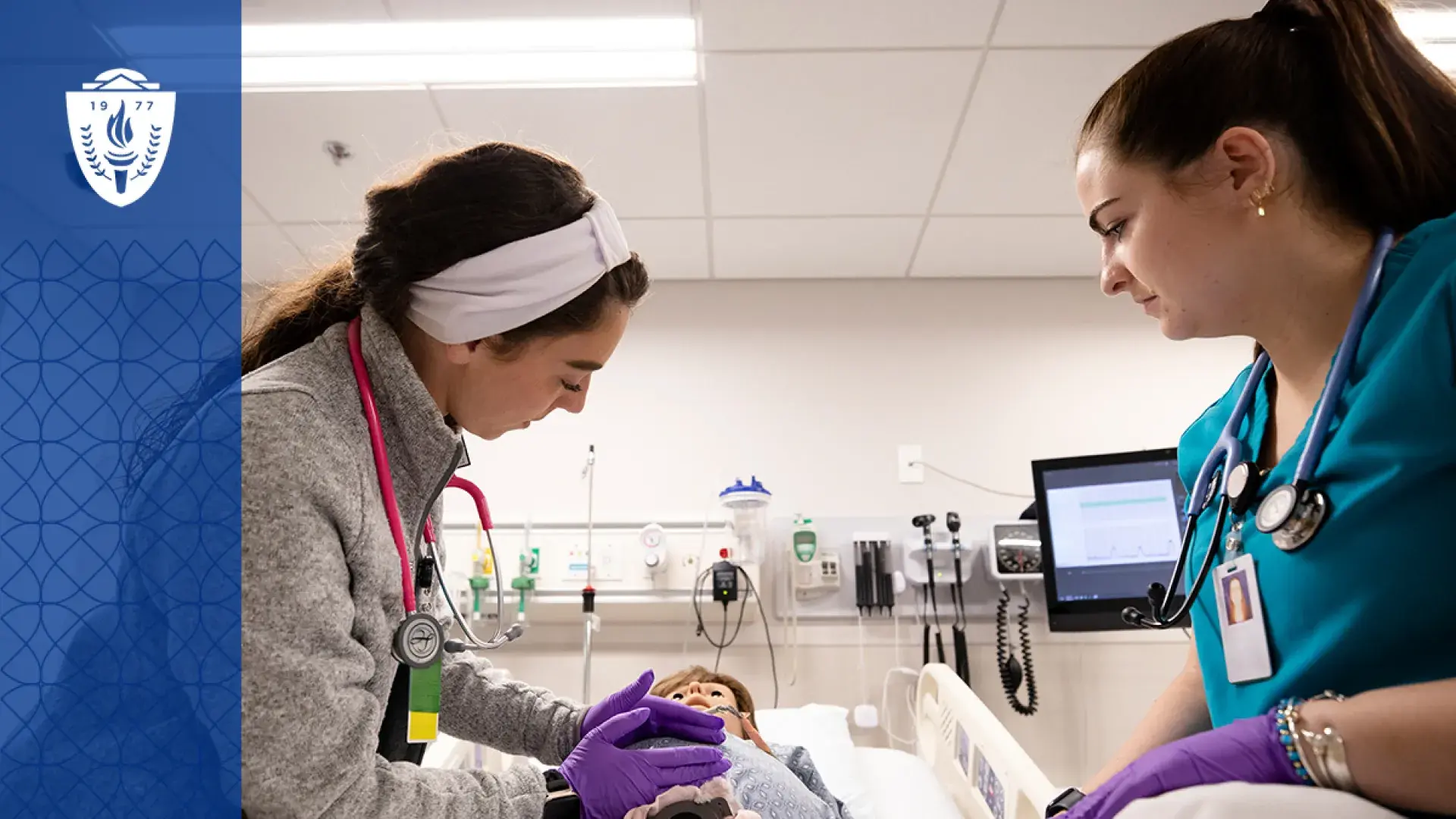Nursing students at MGH IHP practicing hands-on skills in a simulation lab as part of the ABSN program.