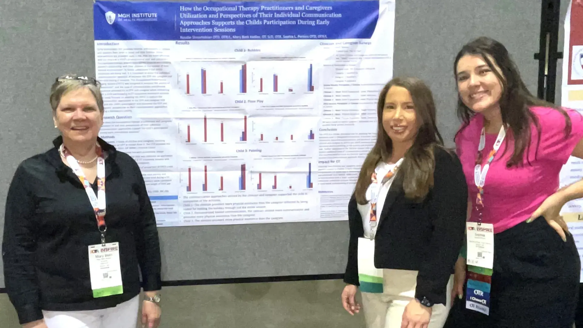 3 people smiling in front of a research poster