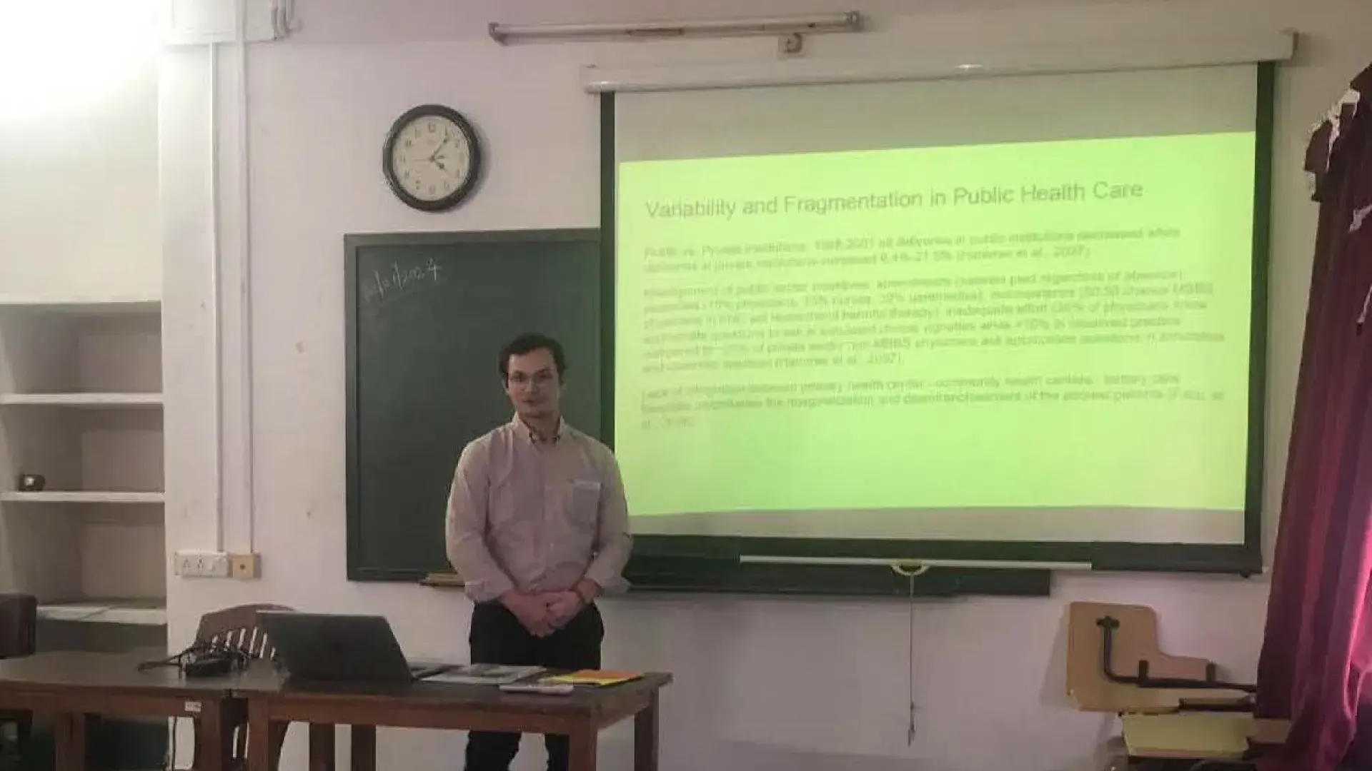 man teaches at front of class