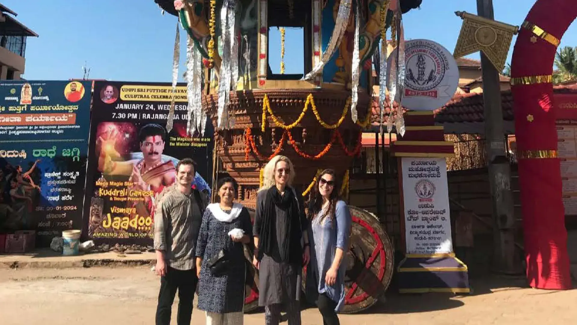people smile in front of temple