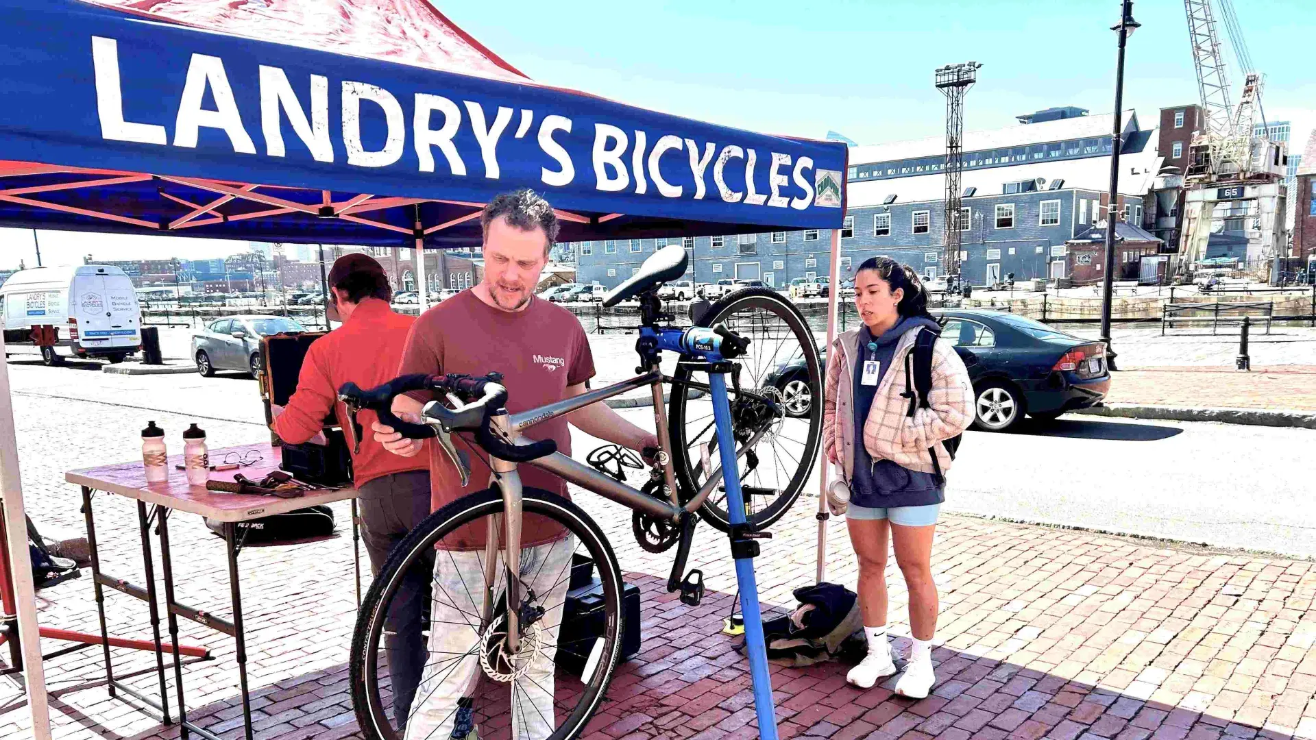 Person tuning a bicycle