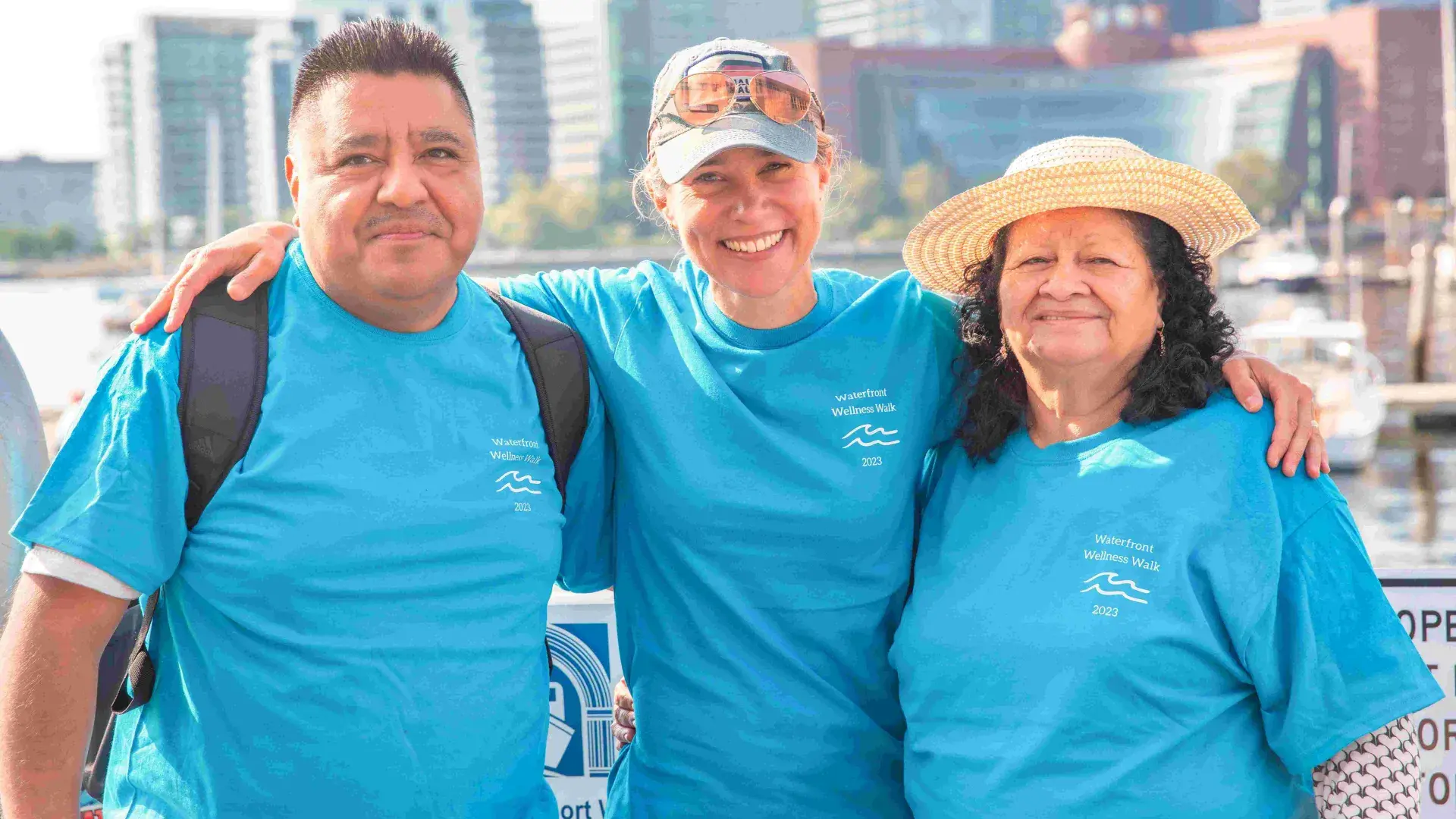 Three people smiling