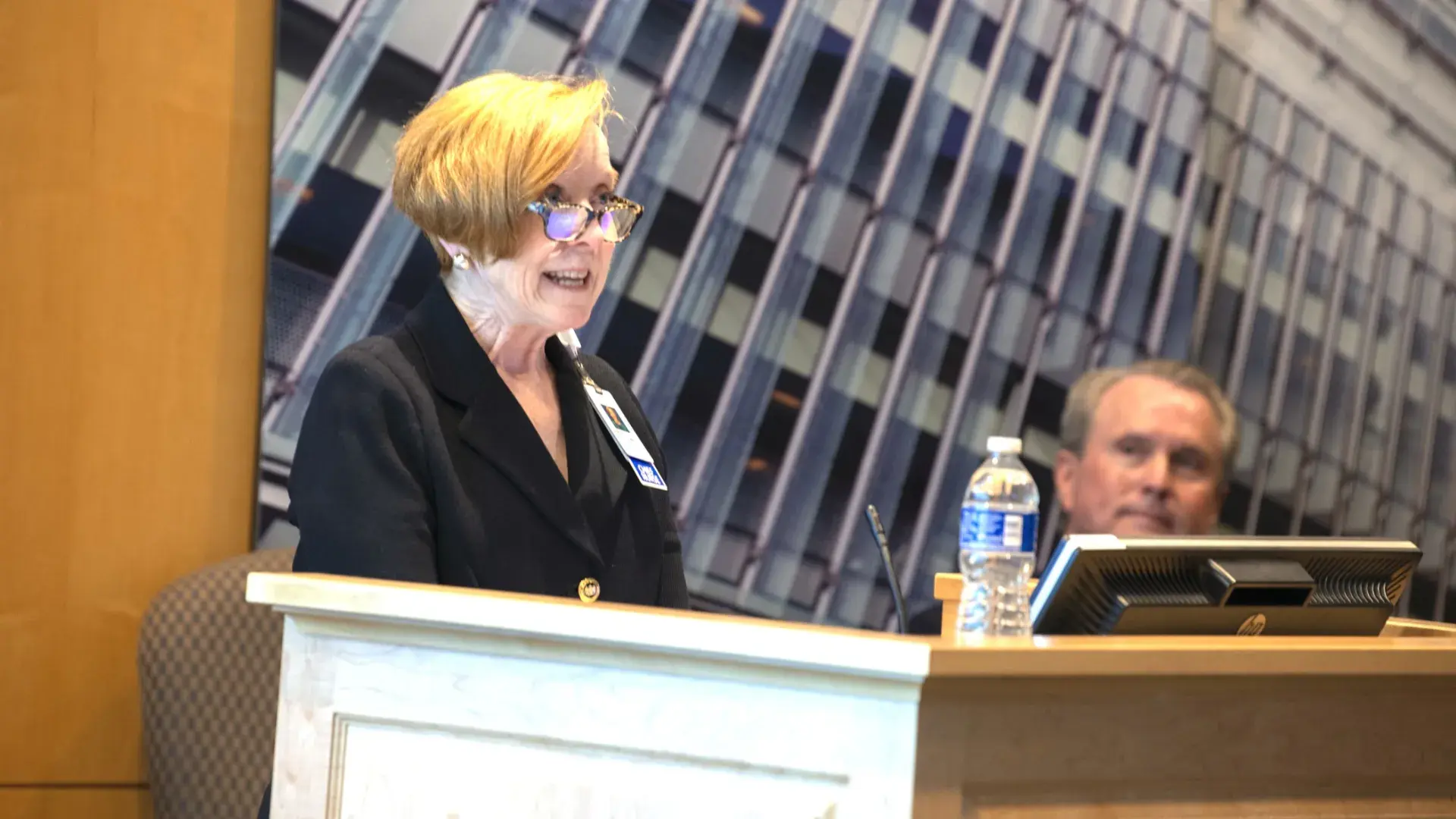 Woman speaking at podium