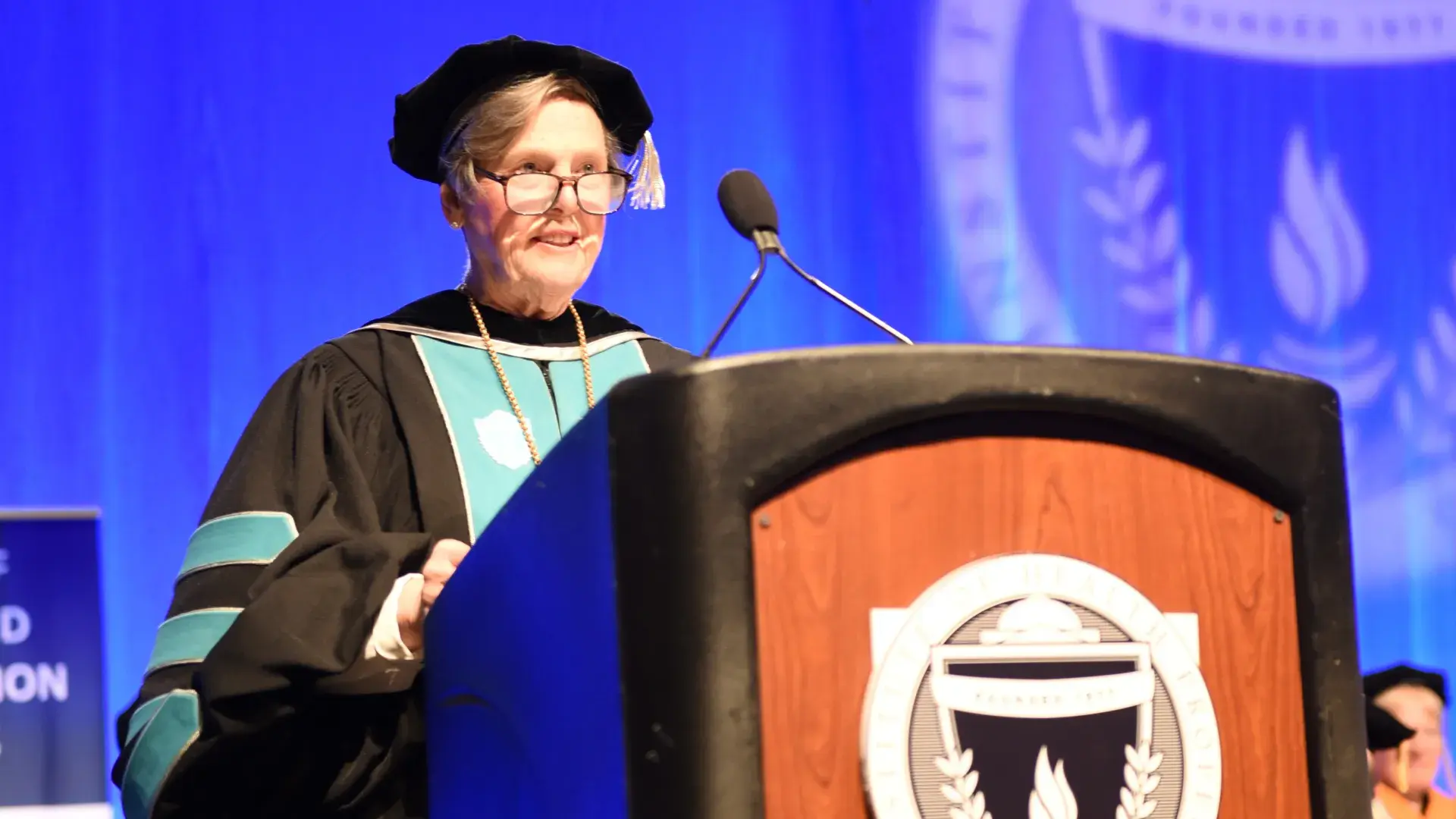woman speaking at podium