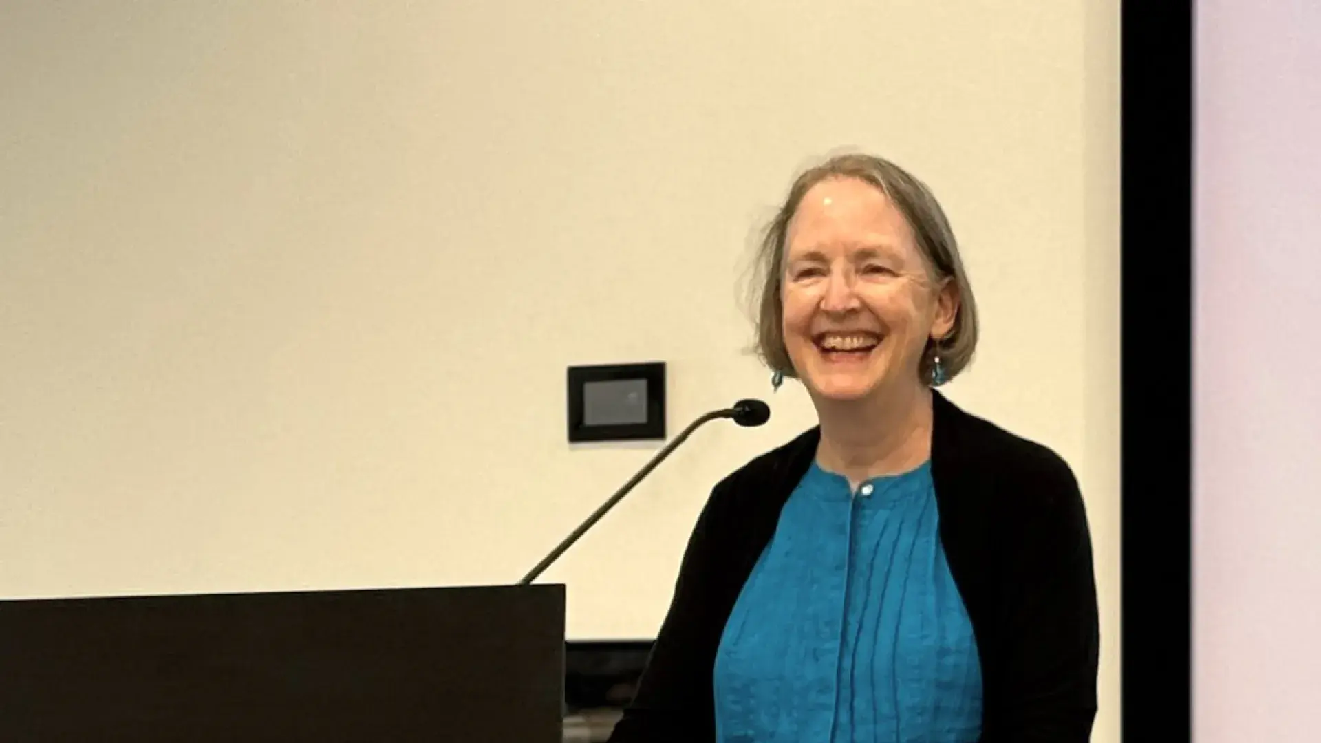 Woman speaking at podium
