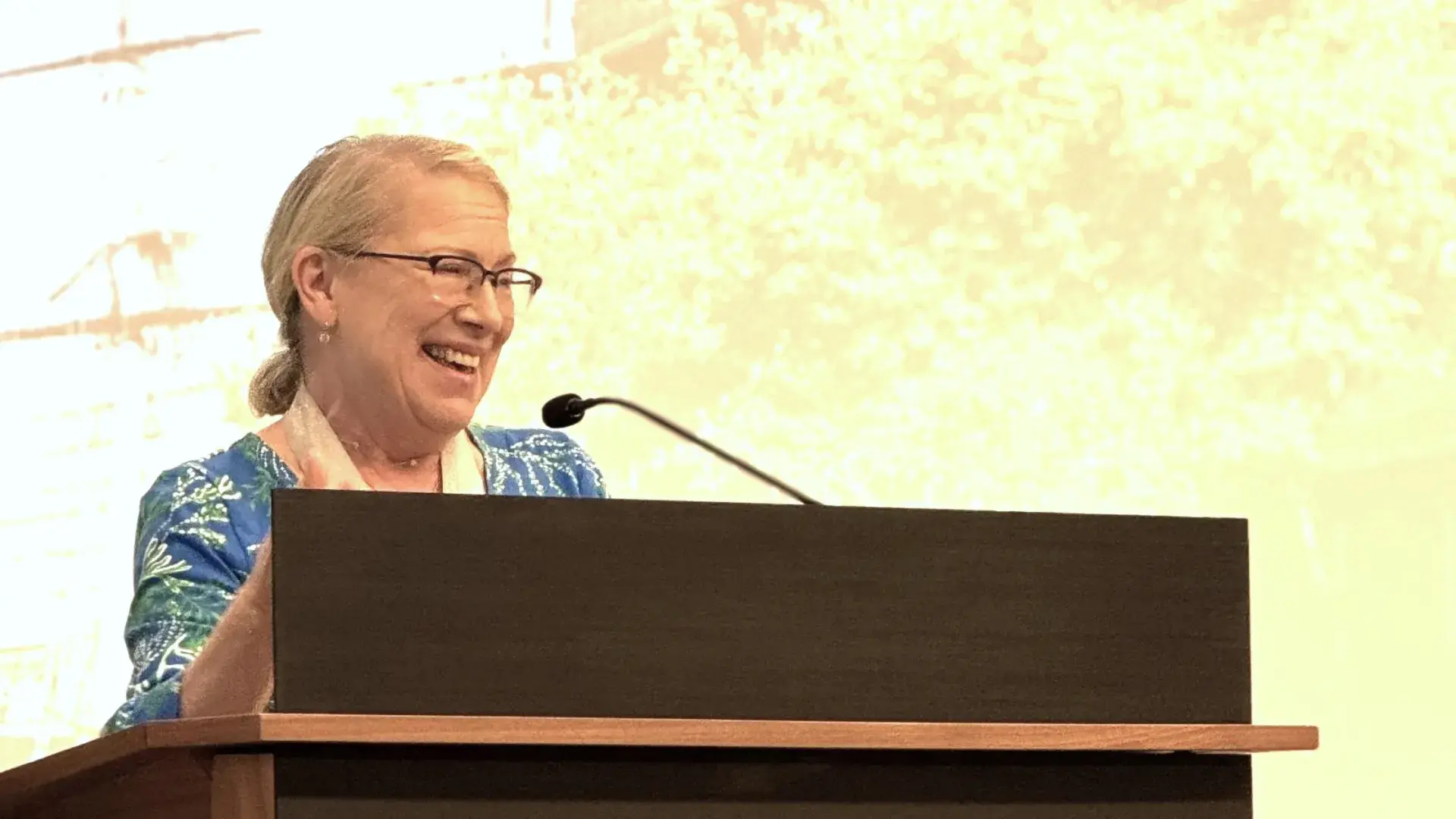 Woman speaking at podium
