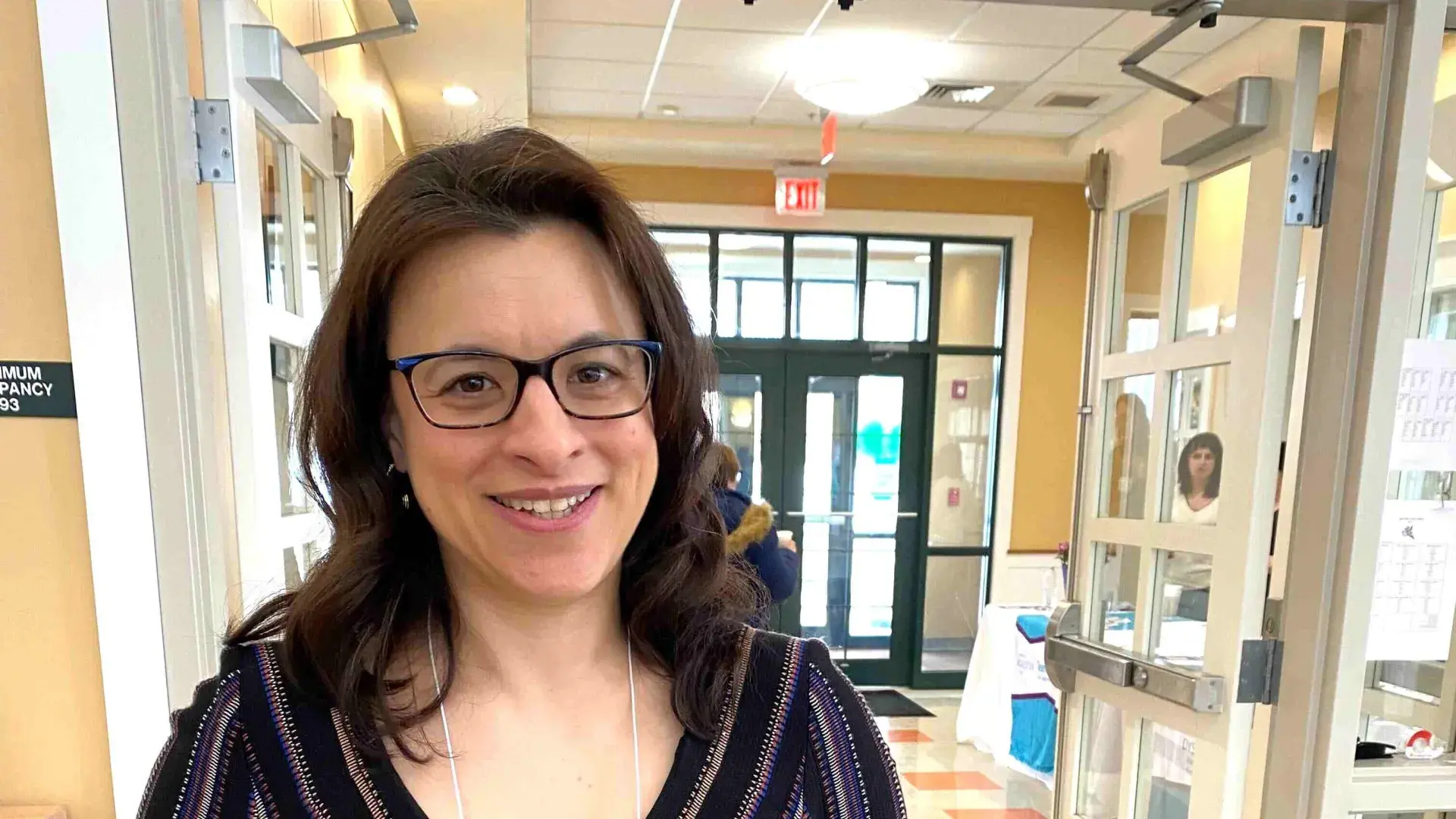 Woman holds an award she received