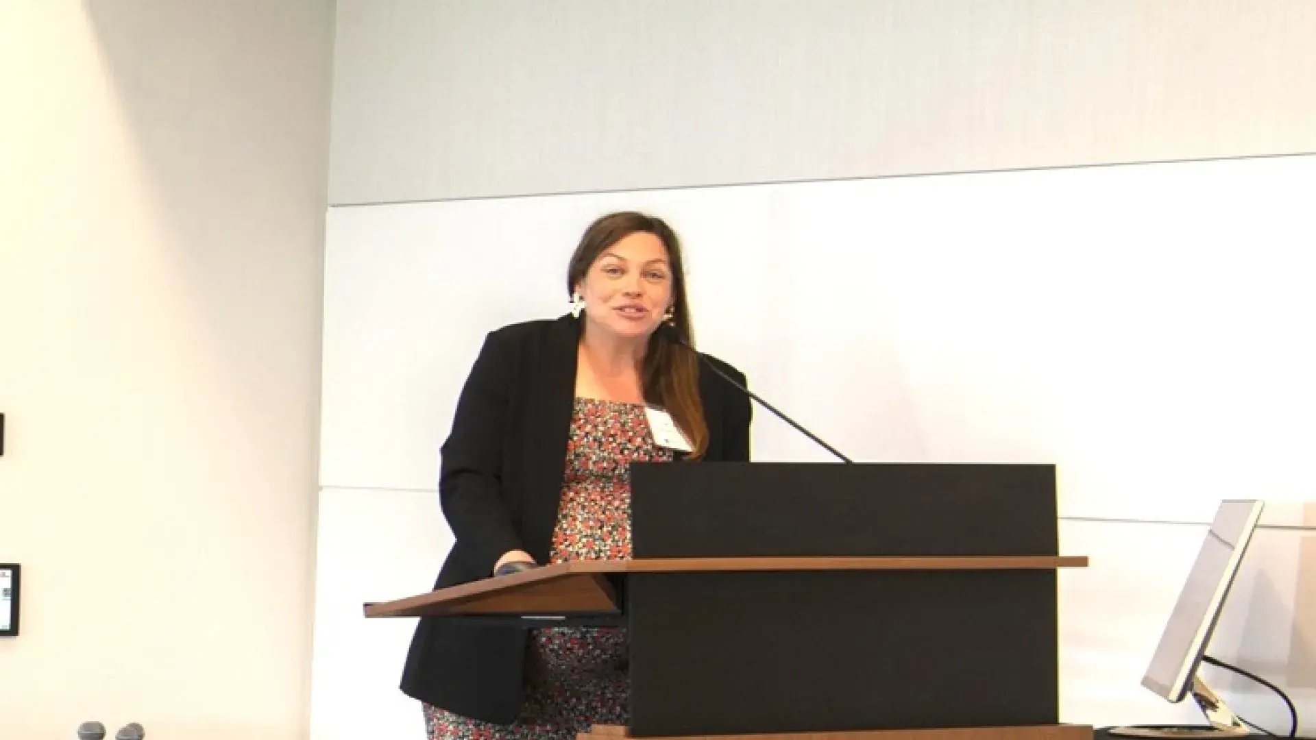 Woman talking at podium