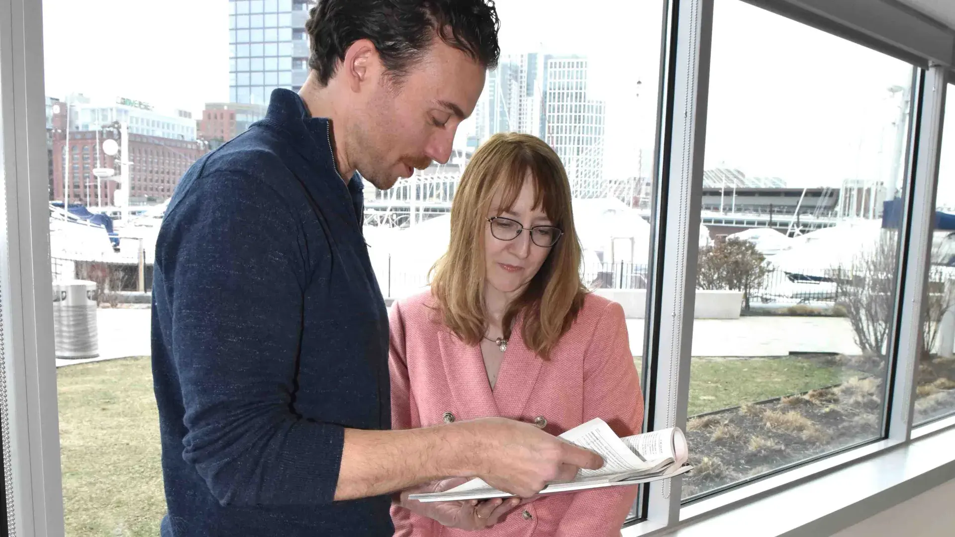 Two people looking at a document