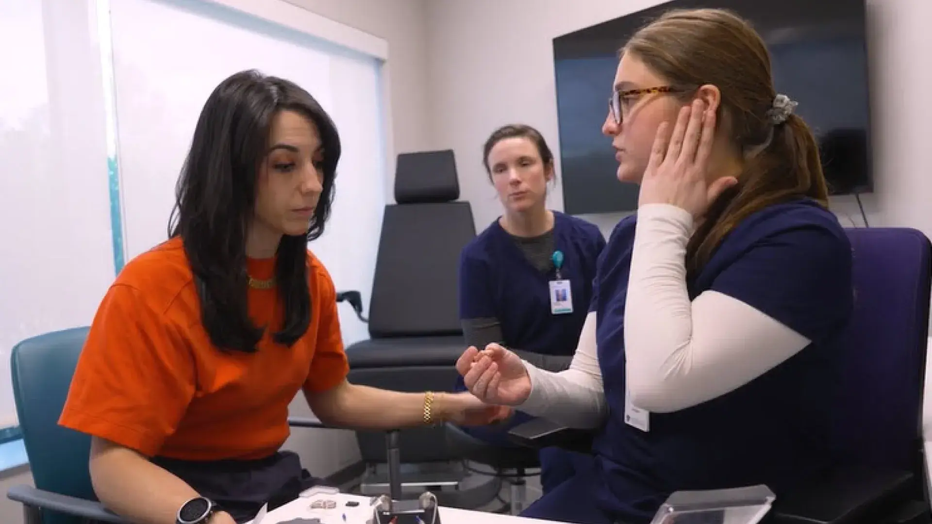 AuD students at MGH IHP engaging in a practical clinical training session under faculty guidance