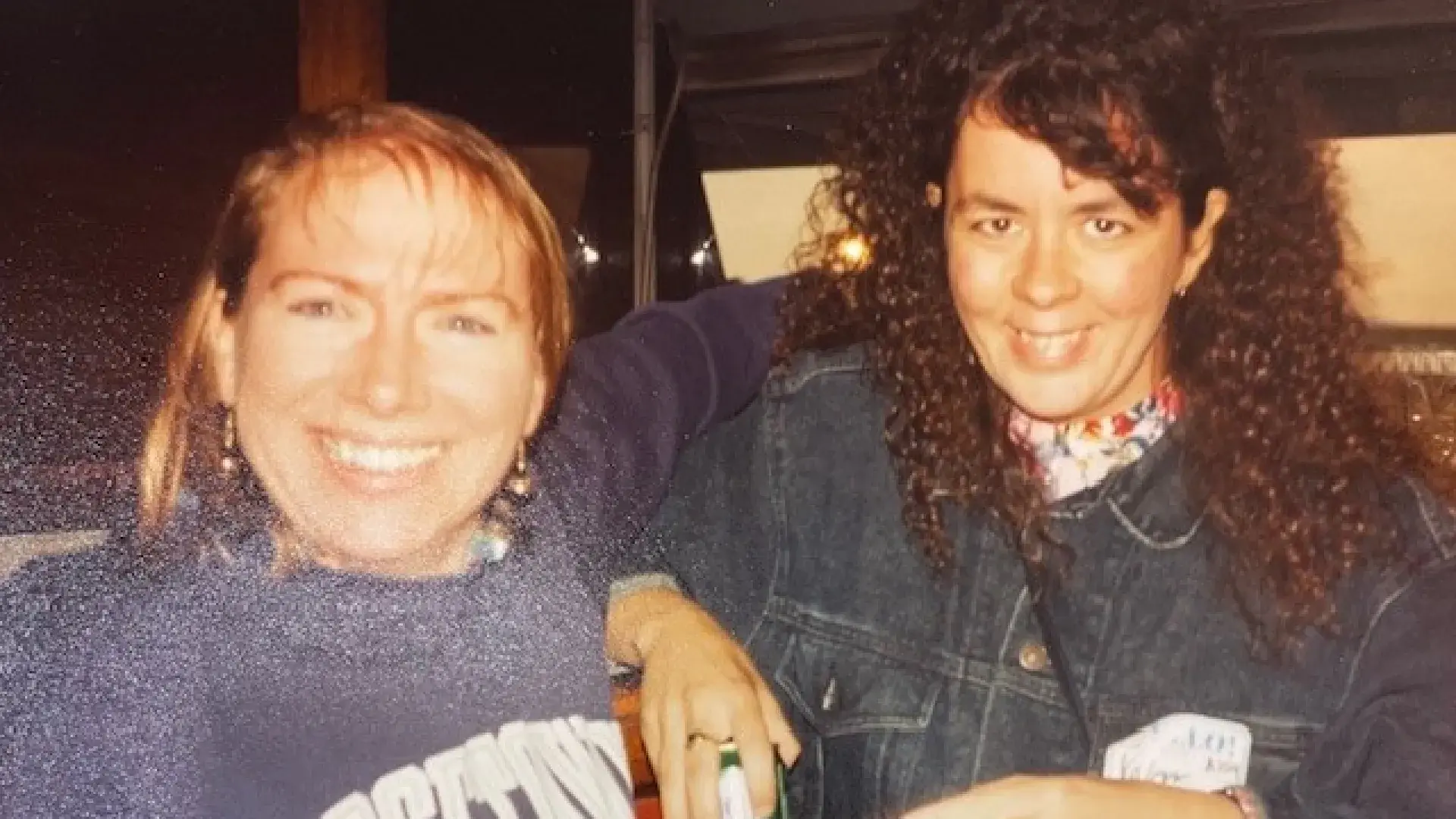 Two woman posing in a casual setting