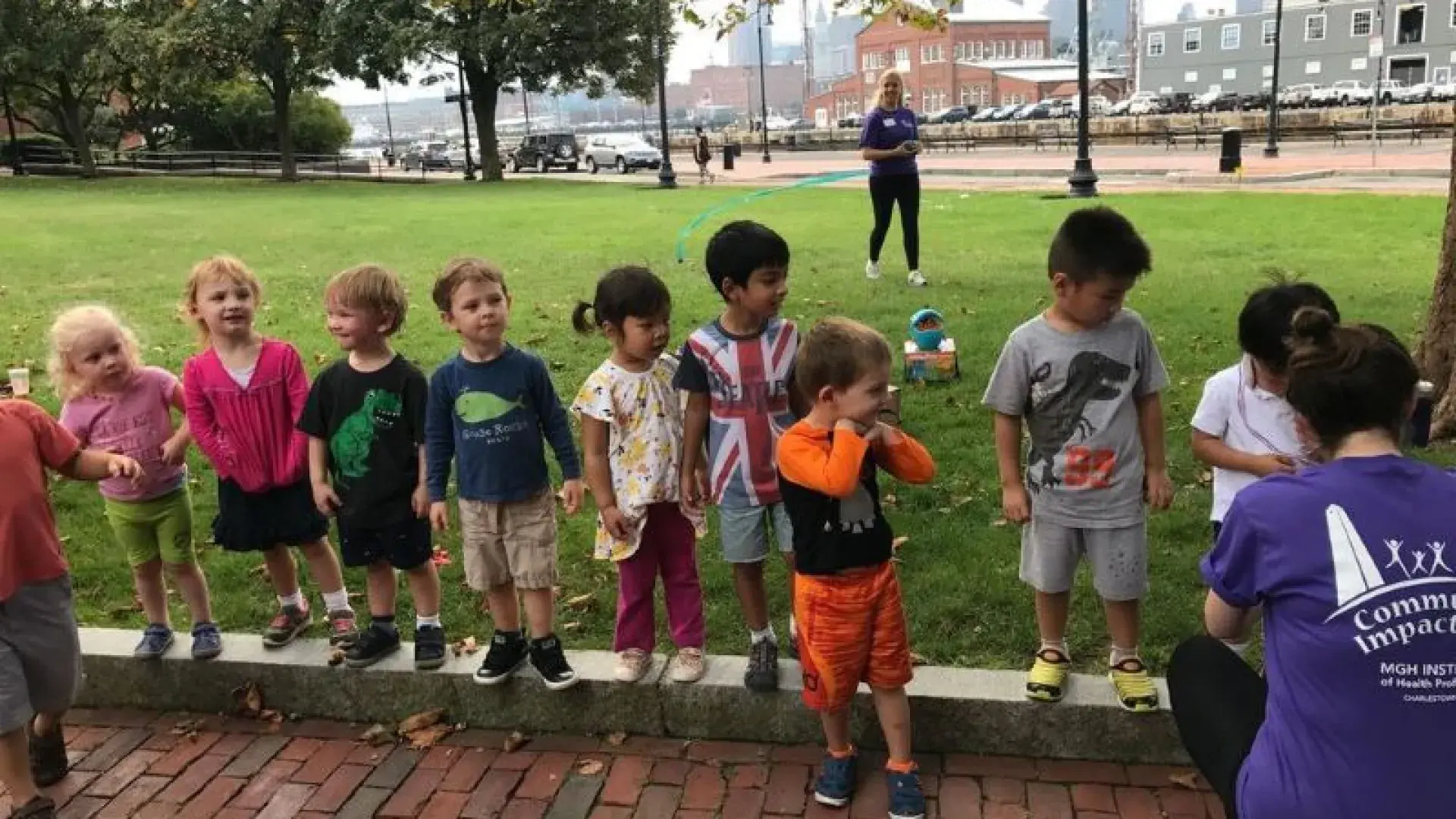 Children wait in a line to receive a medal