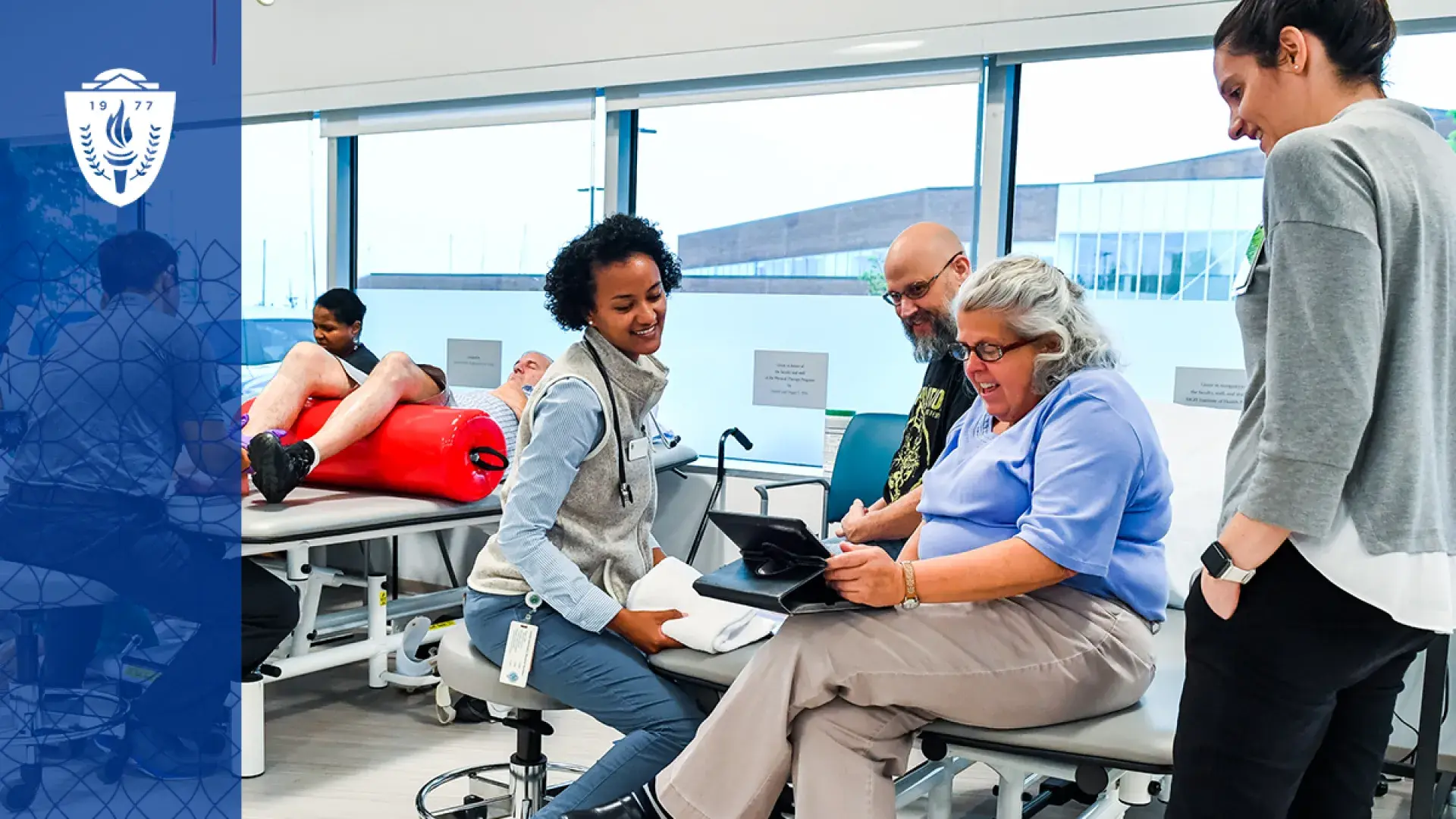 professor surrounded by students in a gym