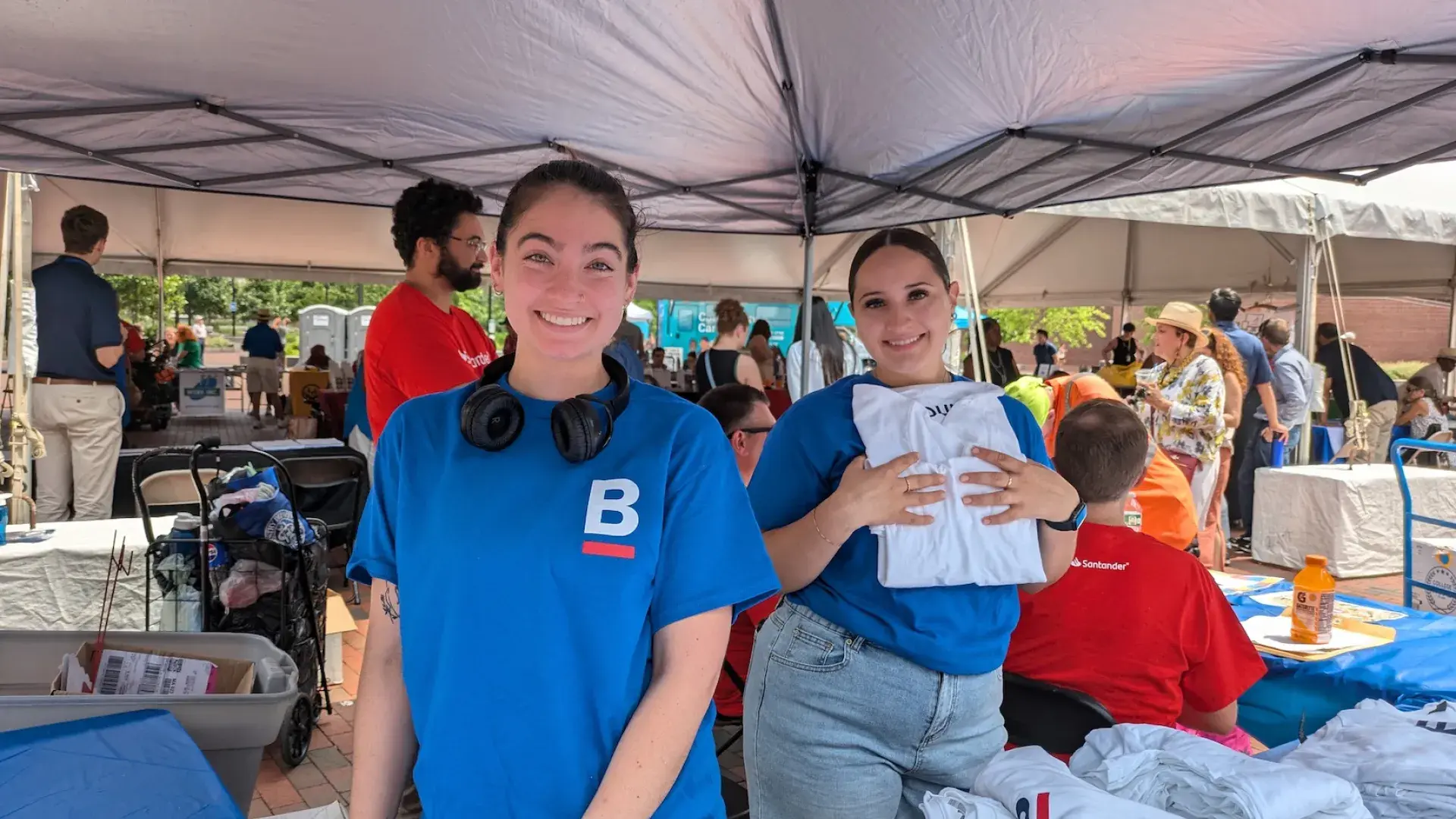Students at the IHP Institute hand out t-shirts at the City of Boston's ADA Day event.