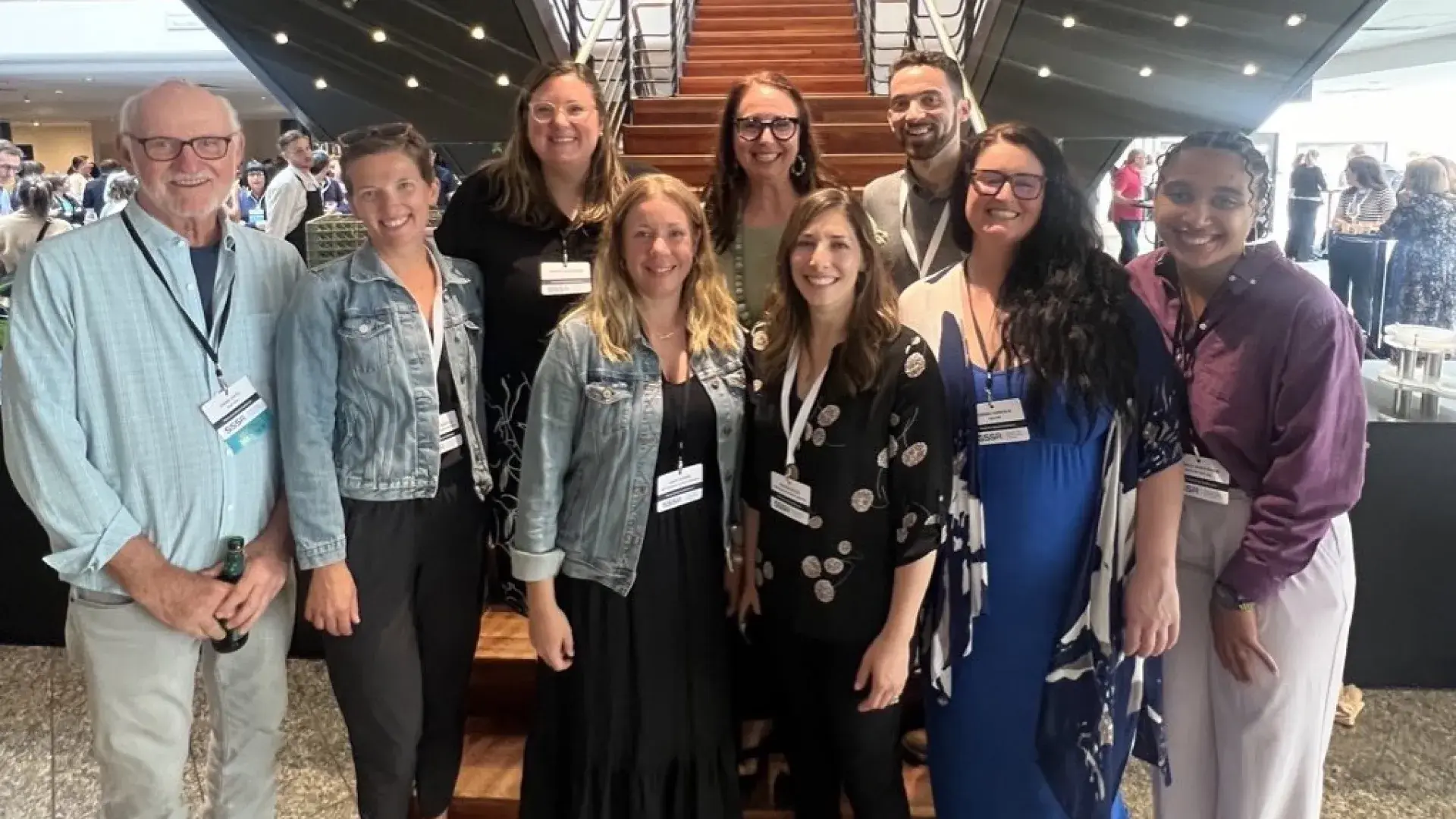 SAiL lab members pose in front of staircase.