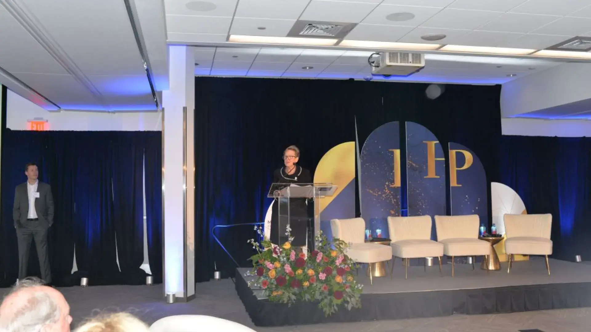 Keynote speaker addressing the audience at the MGH Institute of Health Professions event focused on investing in the future of healthcare.