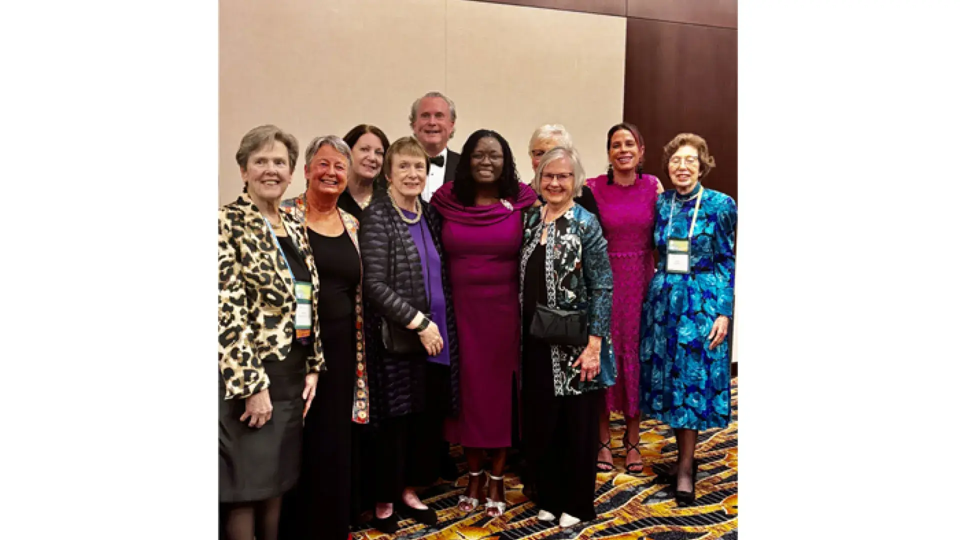A group of people stand to pose for a photo