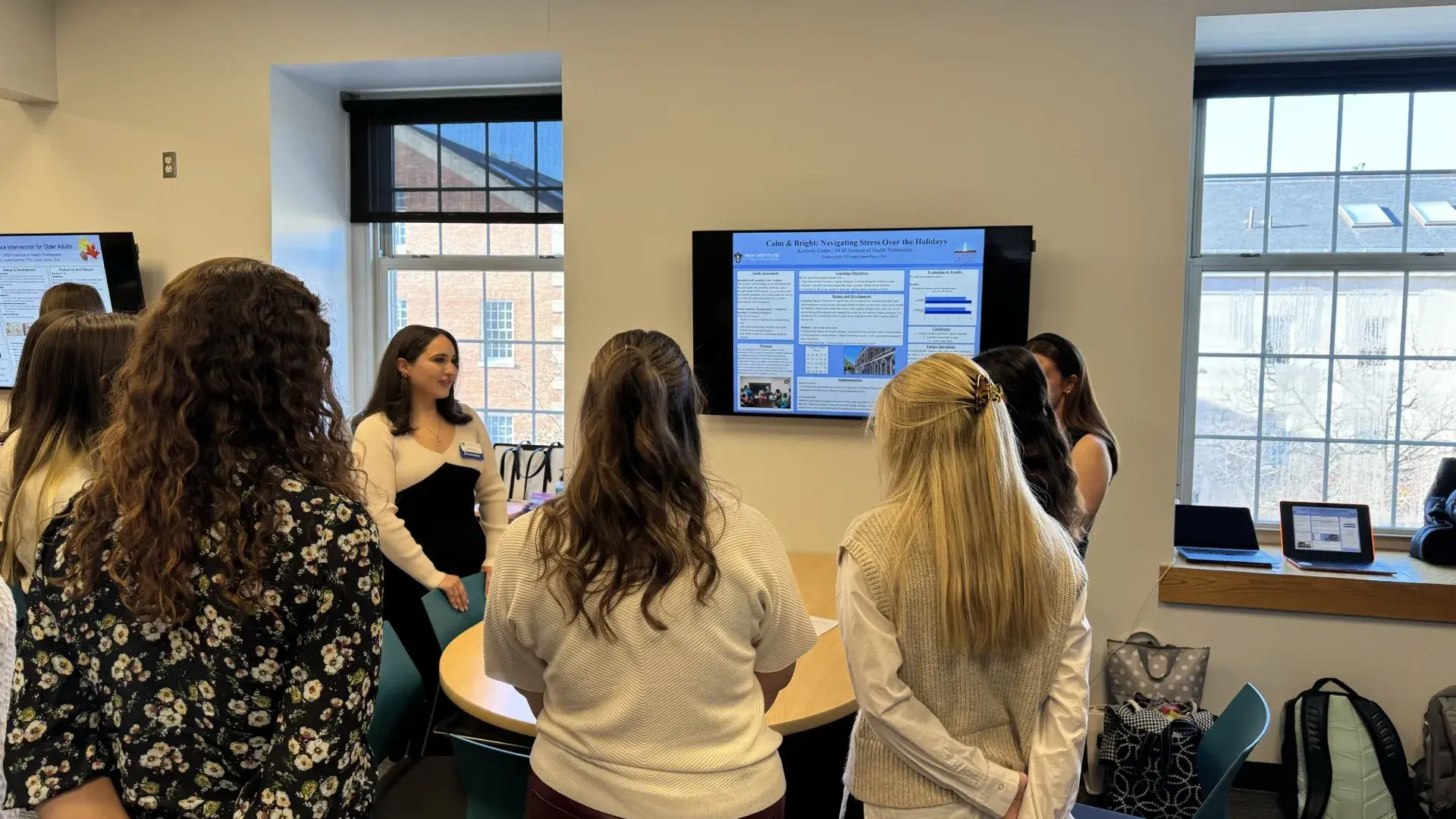 group of women around a tv