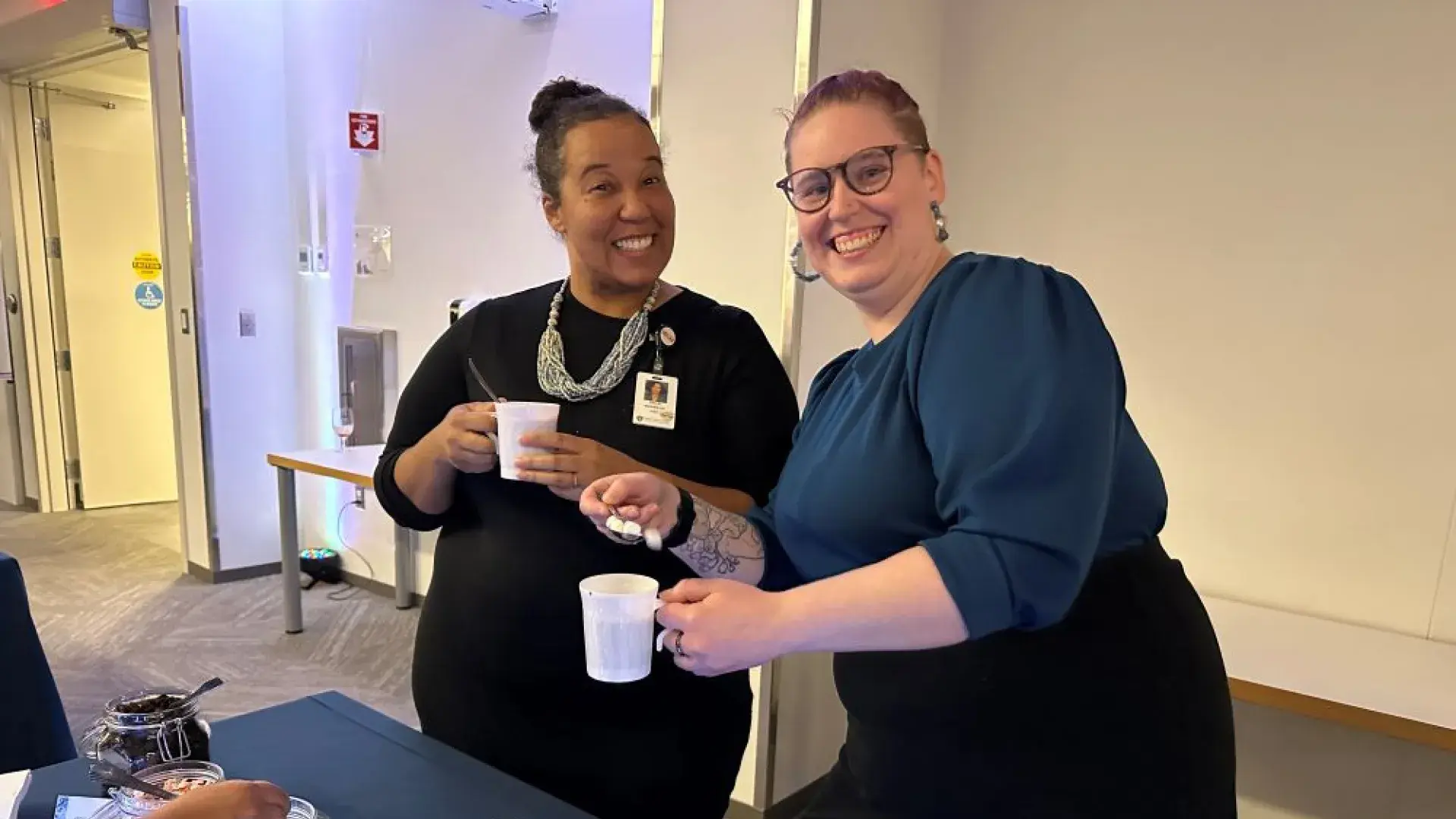 Two people posing with hot chocolate