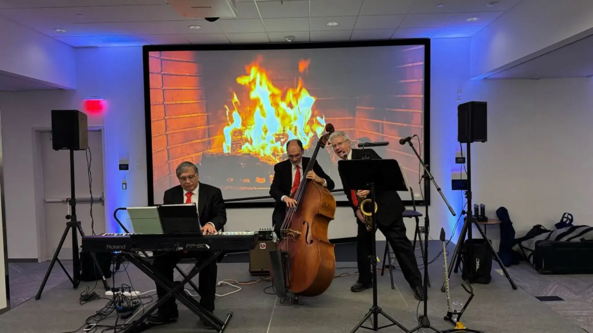 3 men standing with instruments.
