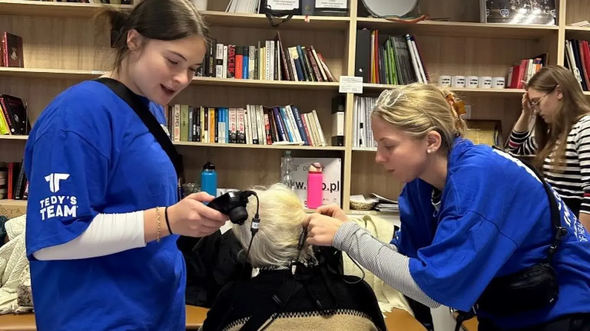 two students performing hearing test 