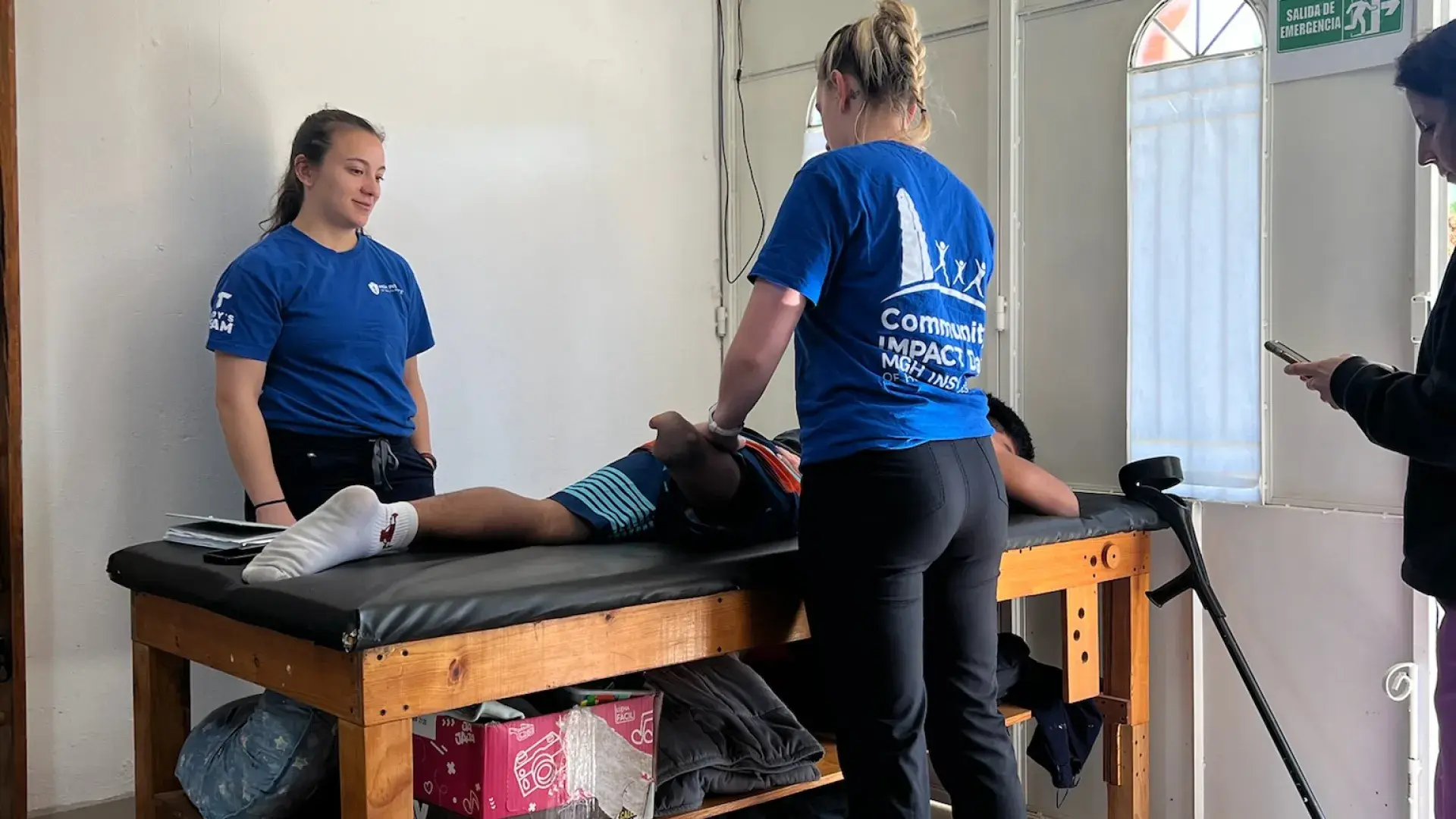 two students with Guatemalan patient 