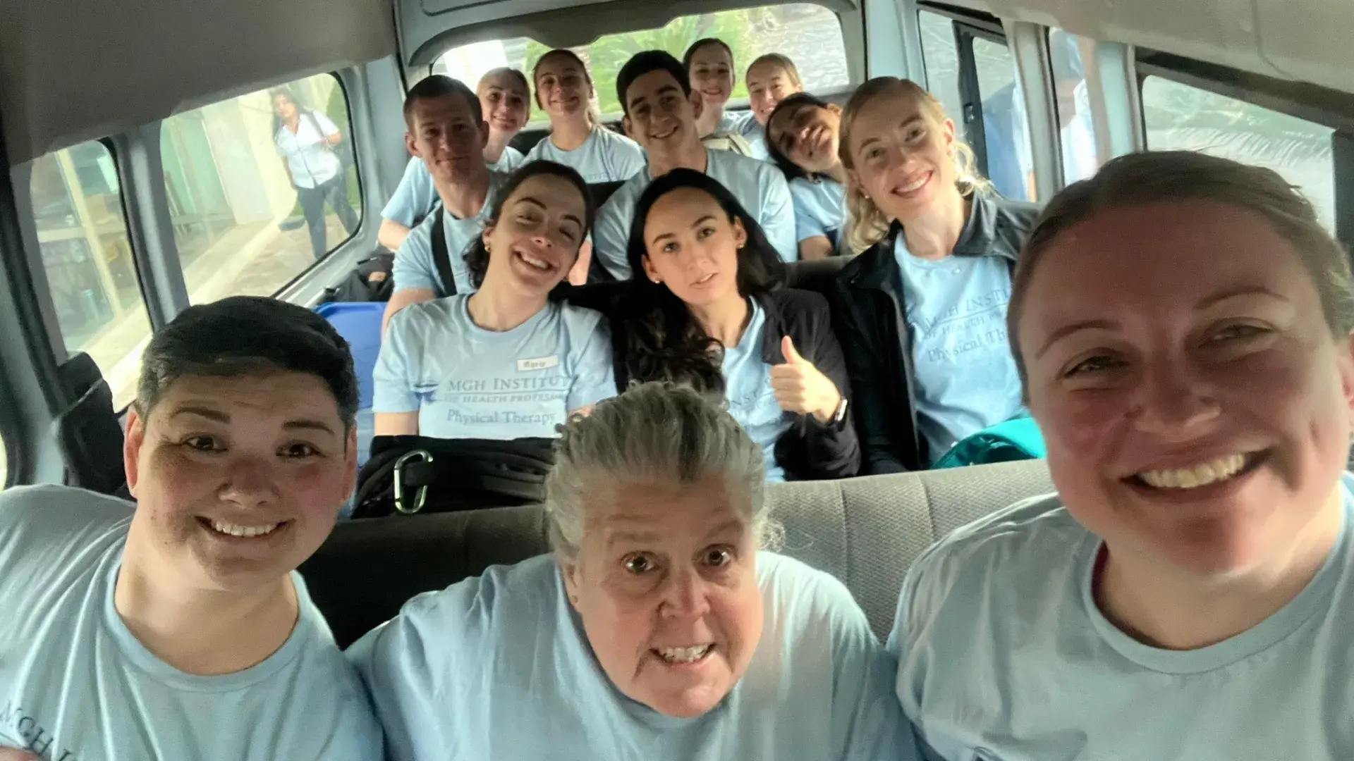 students and faculty on bus travelling to clinic 