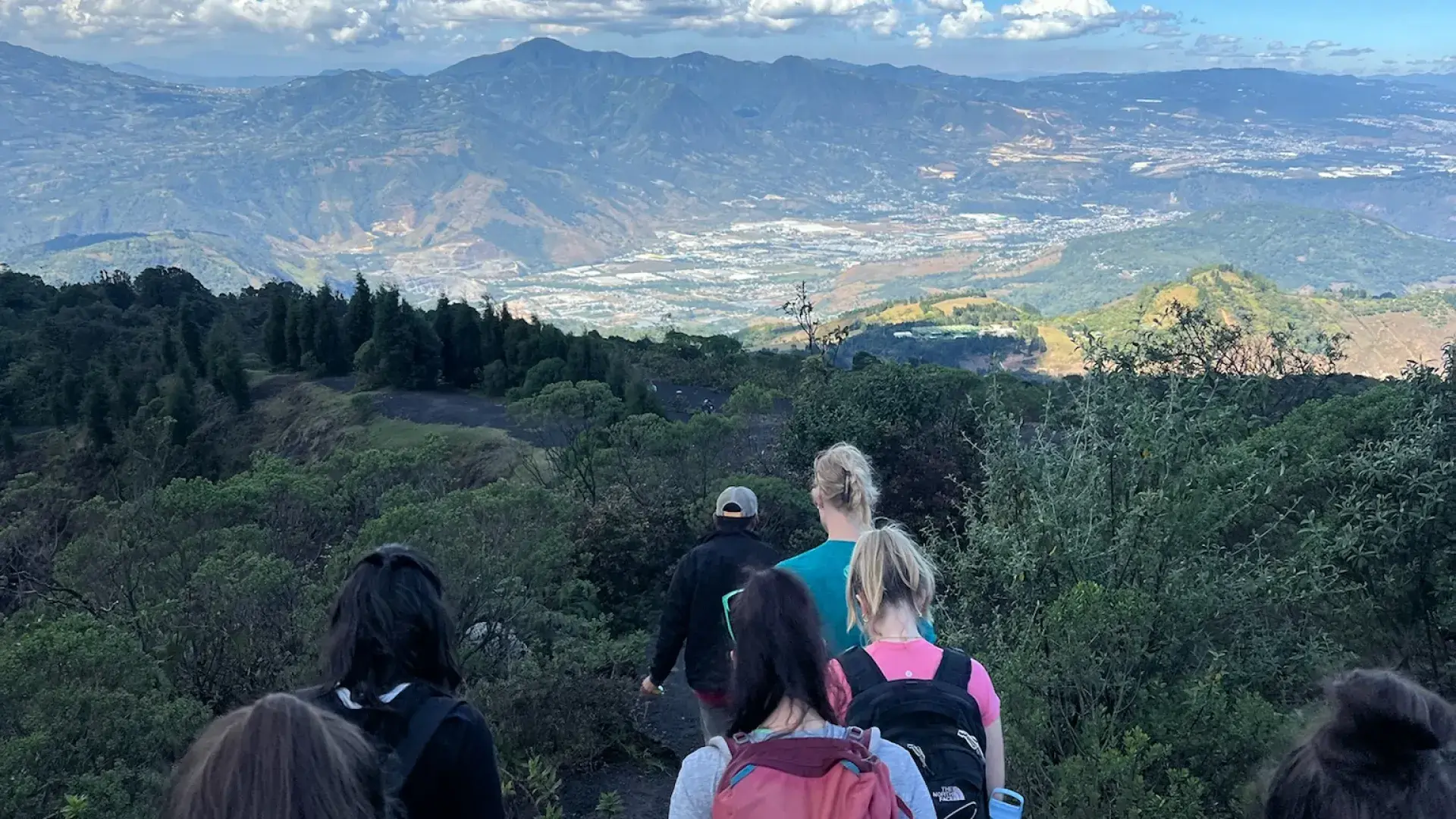 students climbing up volcano