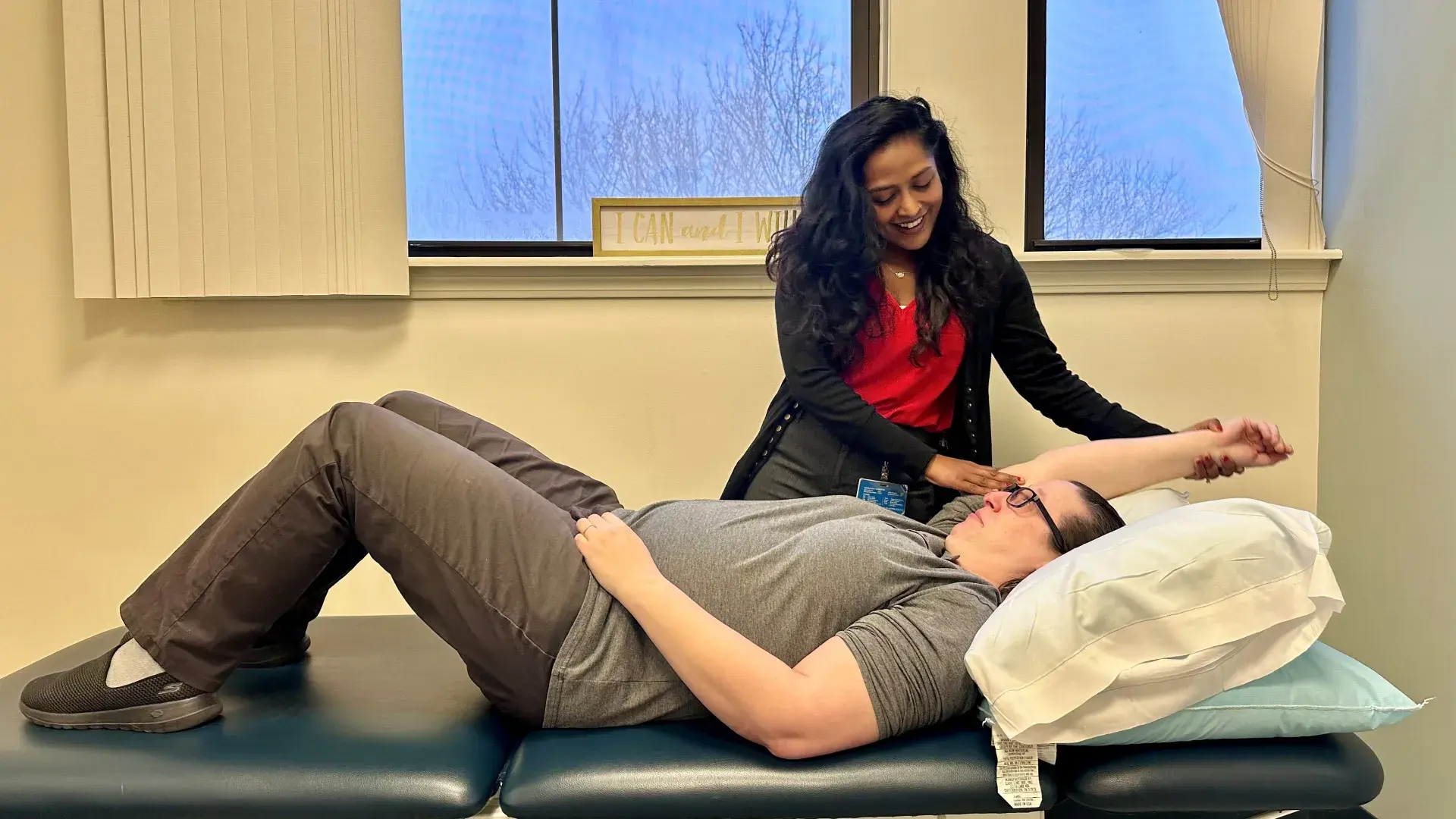 Physicla Therpist with patient on table 