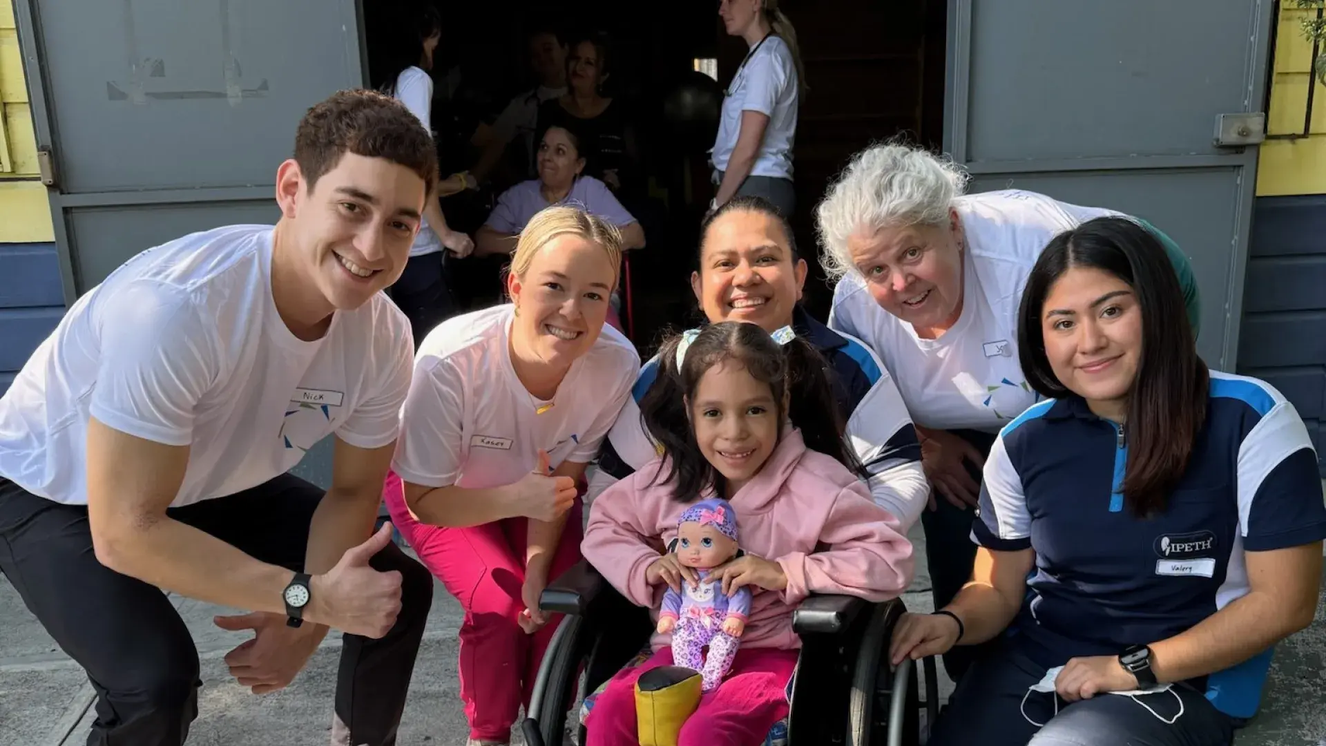 IHP students and Jane Baldwin with patient 