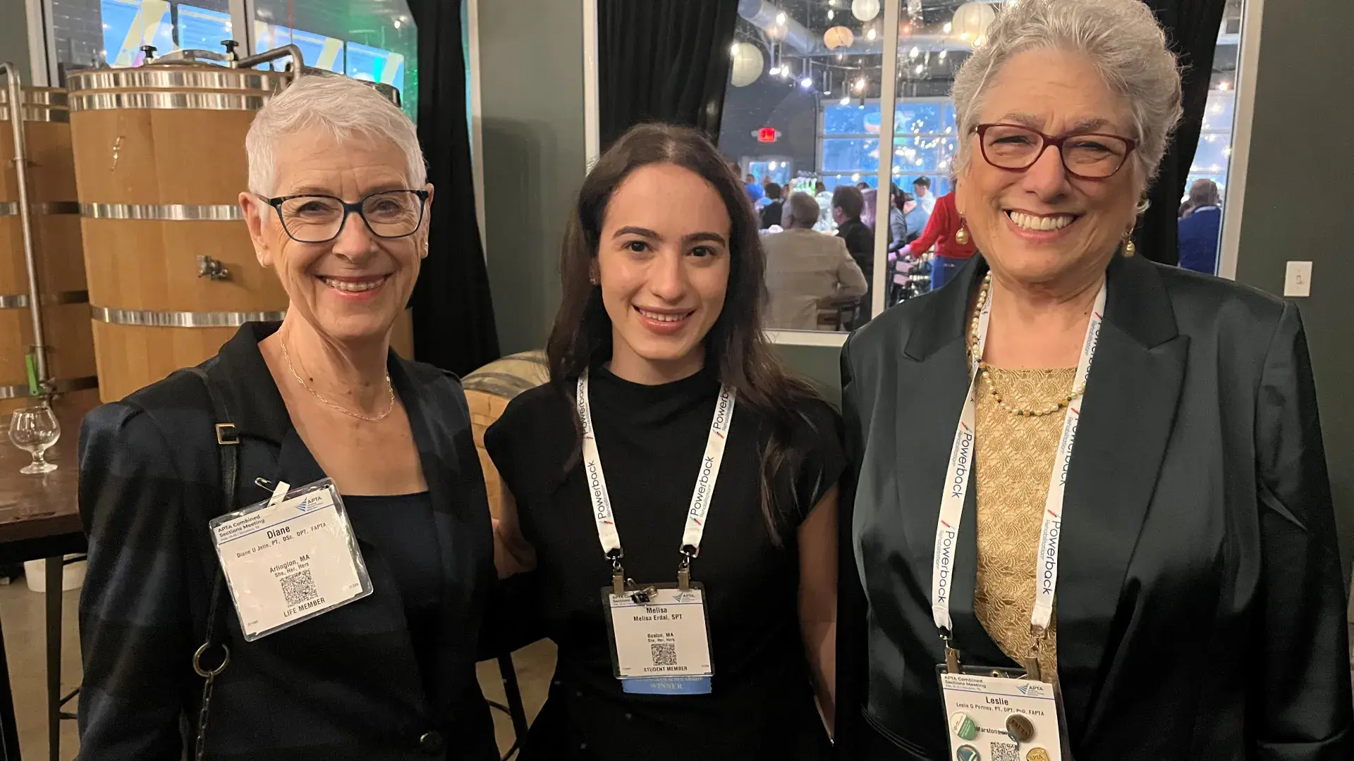 Three women pose for the camera