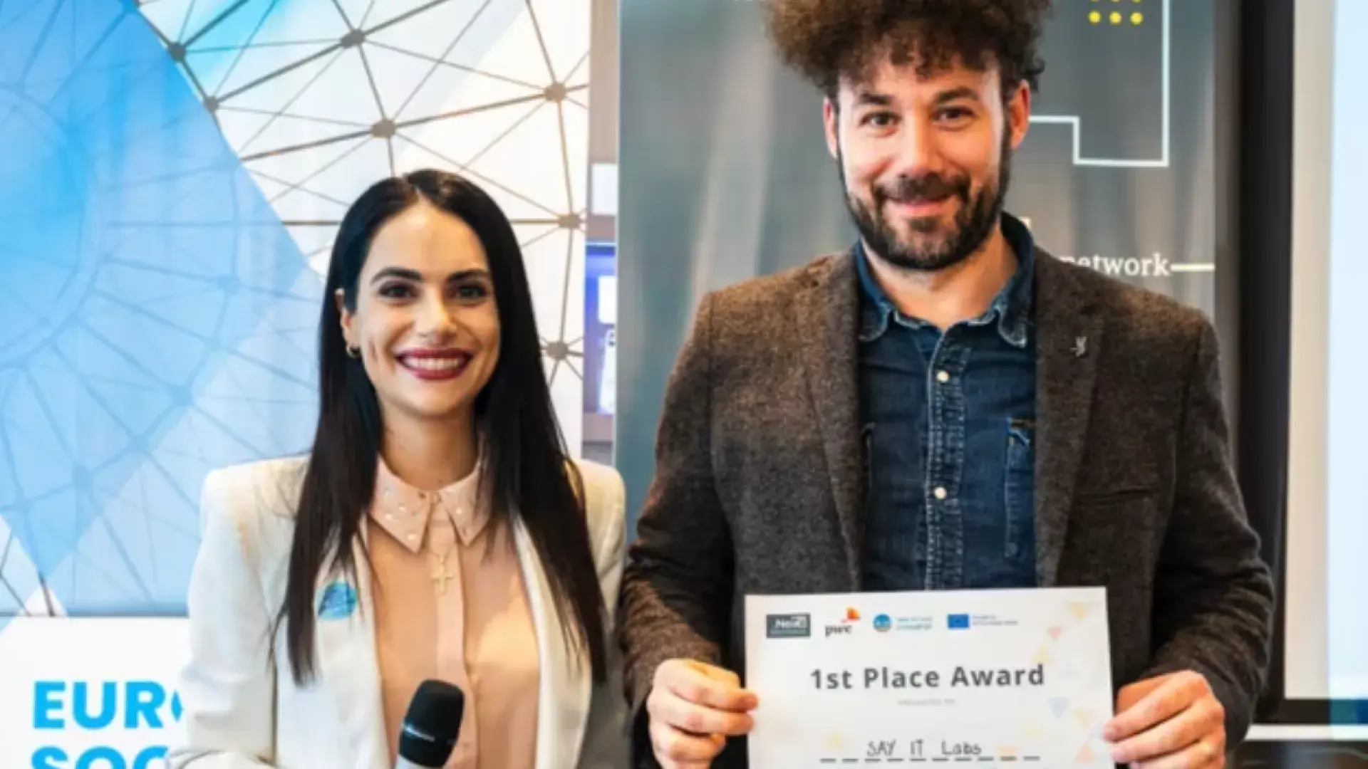 eric holds a 1st place award 