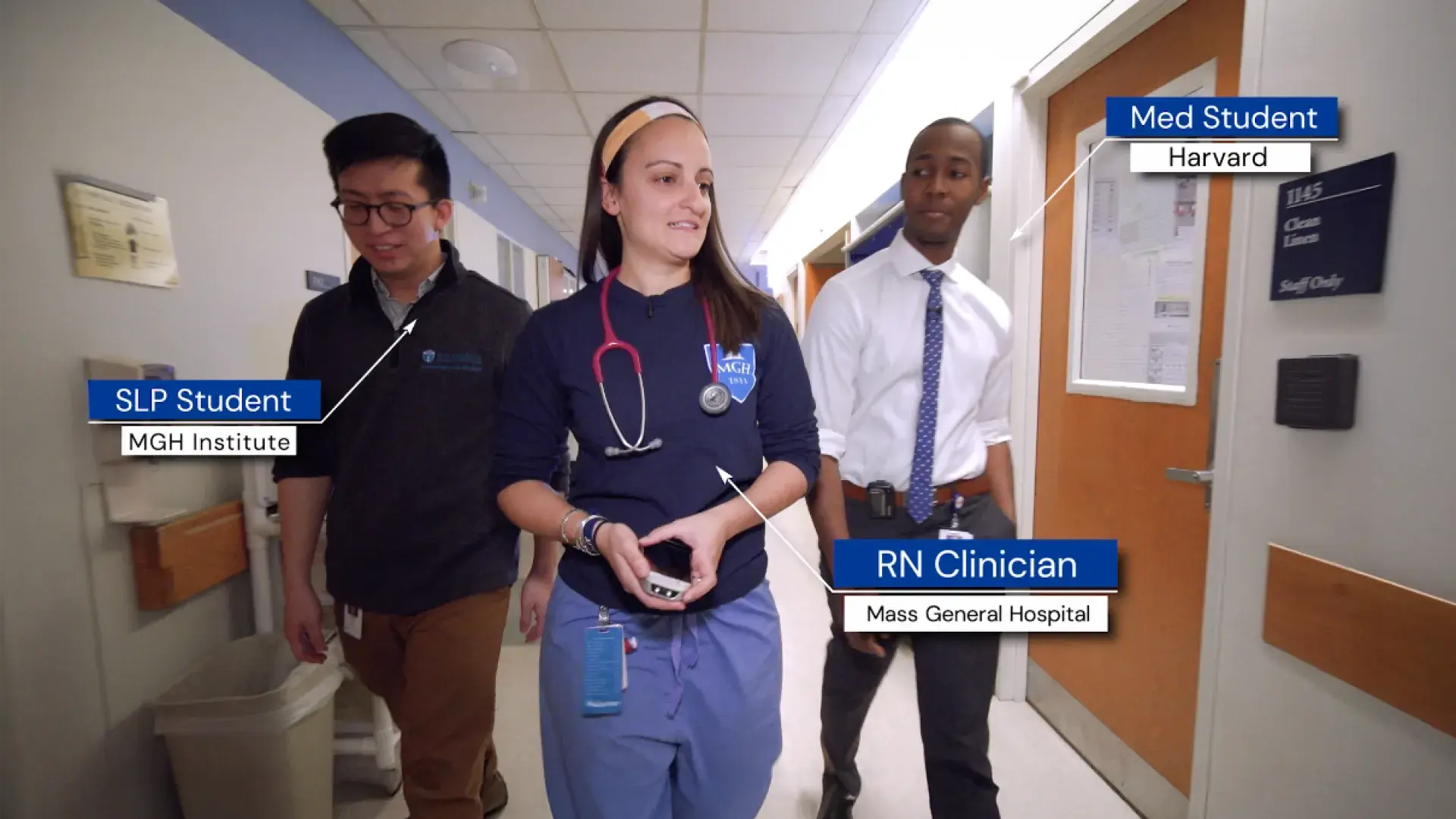 3 people walk down a hallway together, noted to be a SLP Student grom MGH IHP, an RN Clinician from MGH, and a med student from Harvard