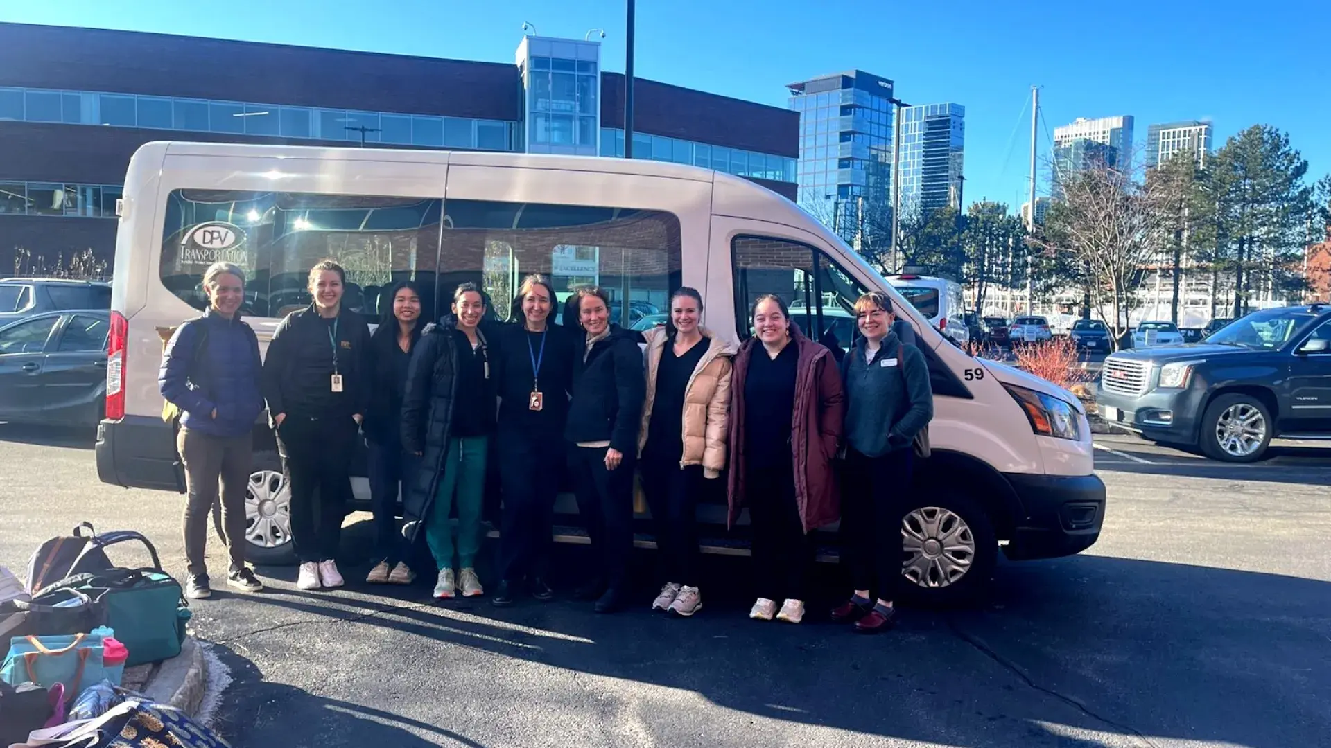 people standing in front of a van