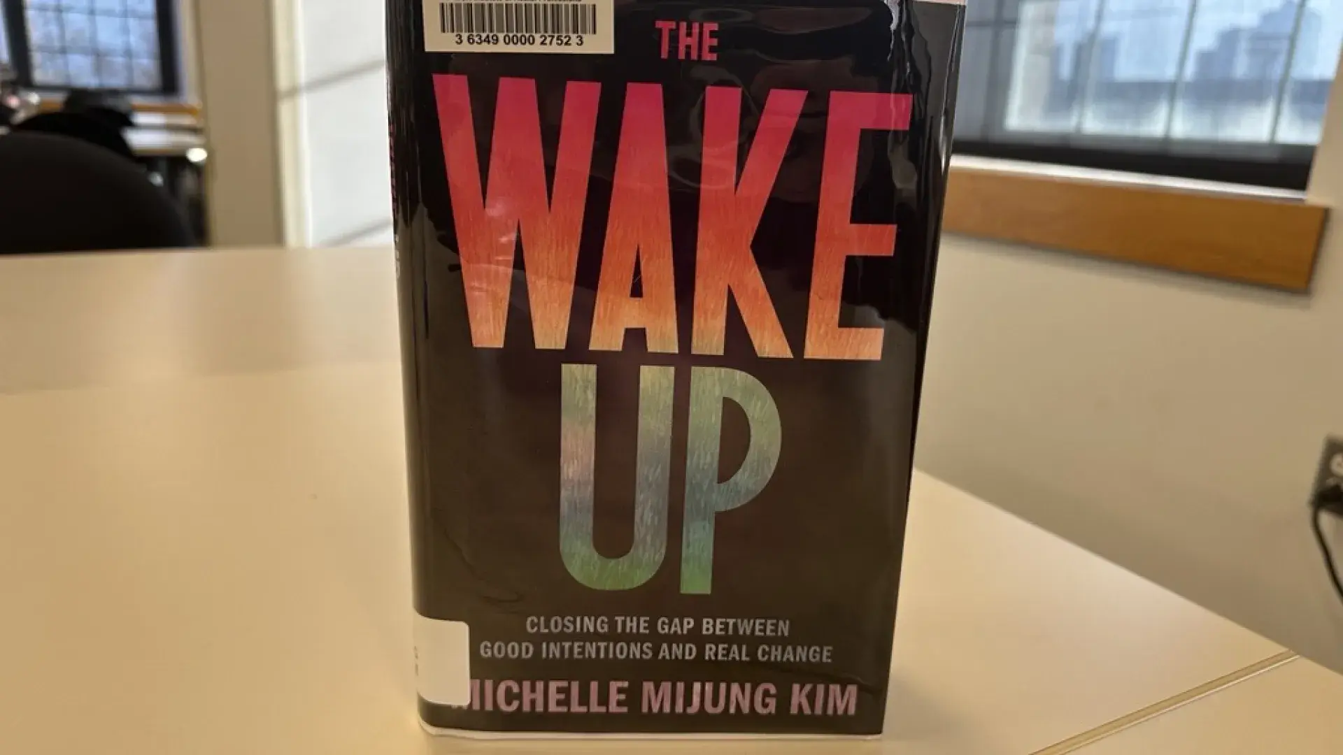 The book The Wake Up stands on a table