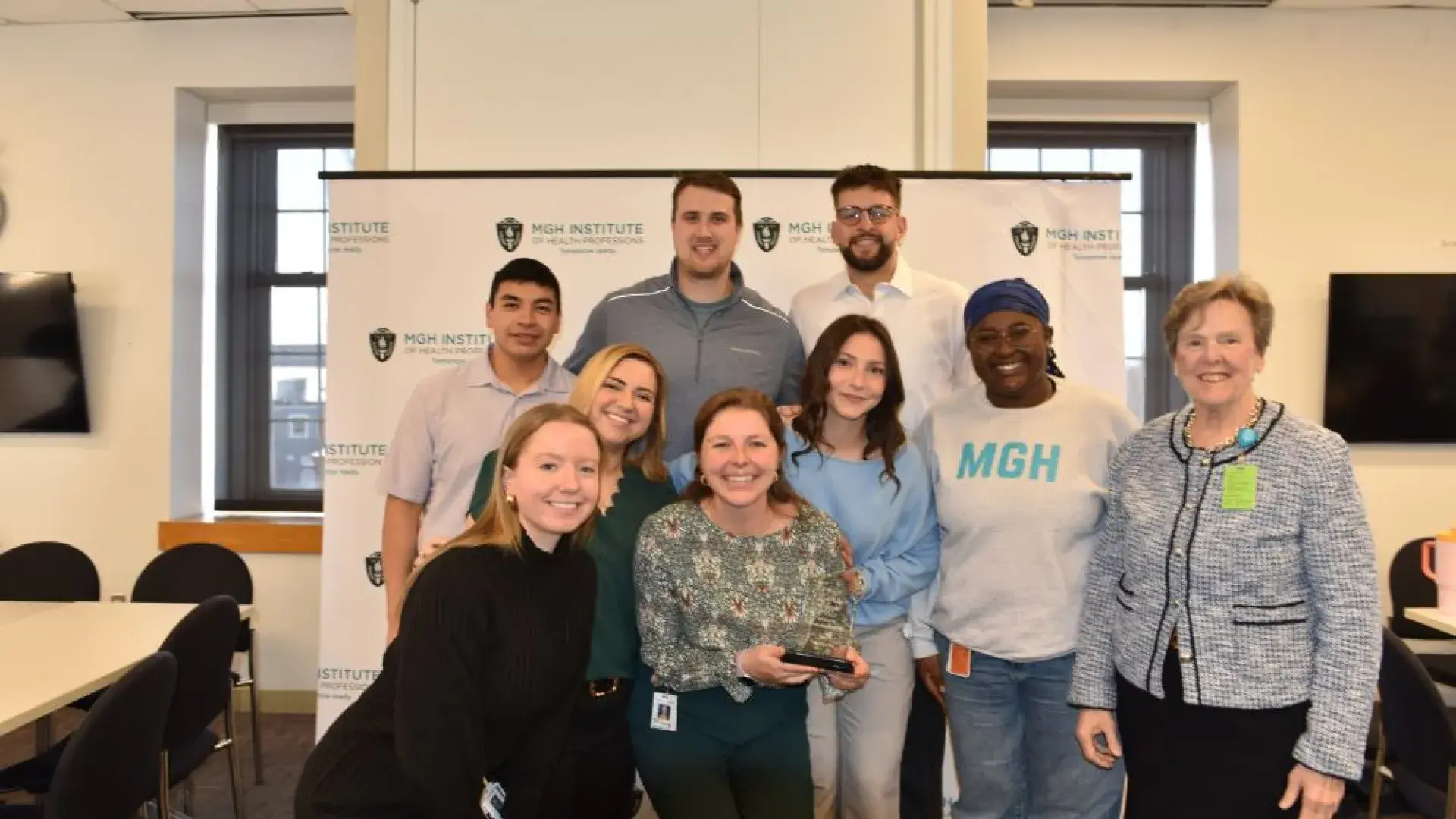 Group of people posing with award