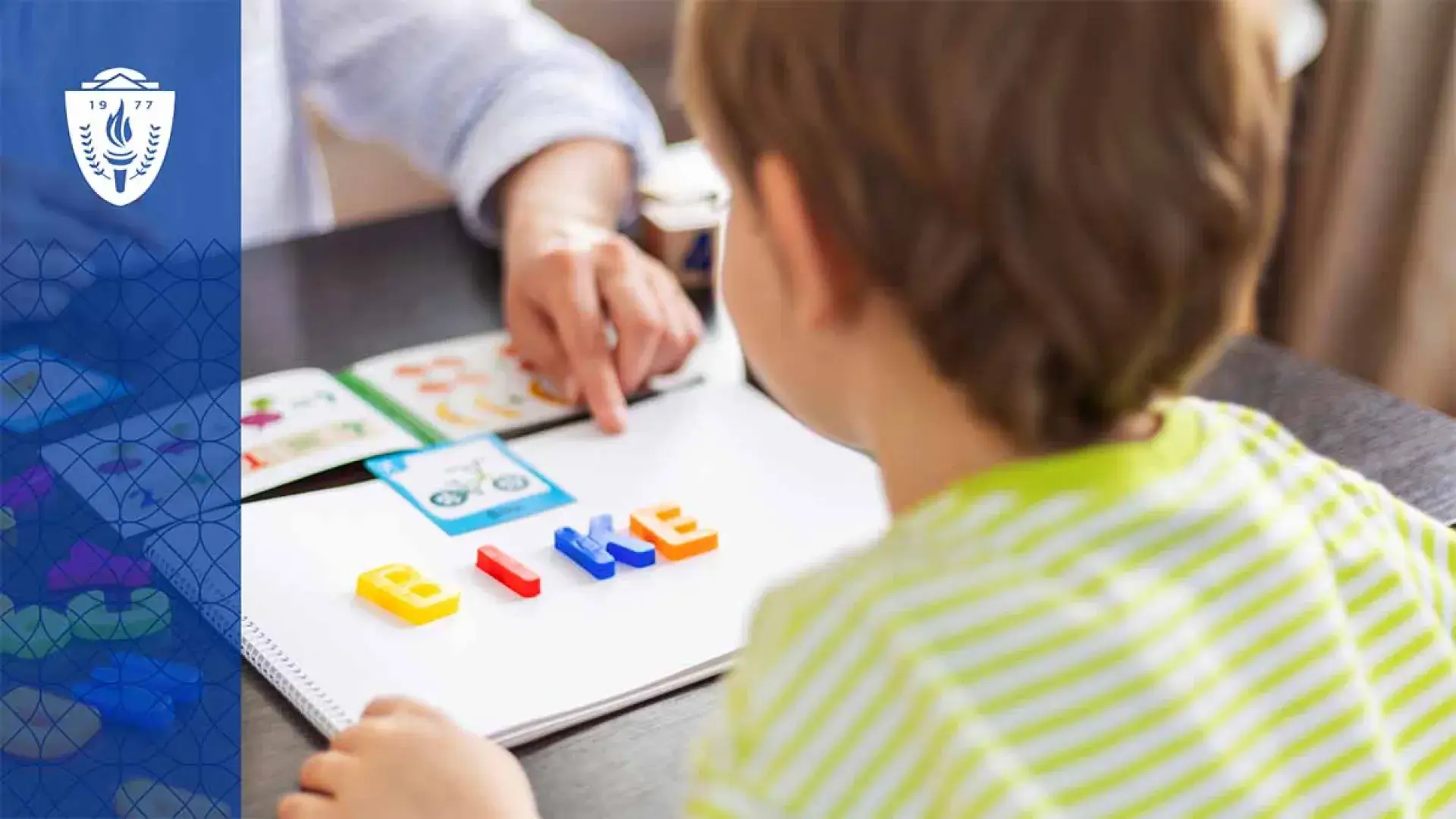 Kid looking at notebook with the word bike on it