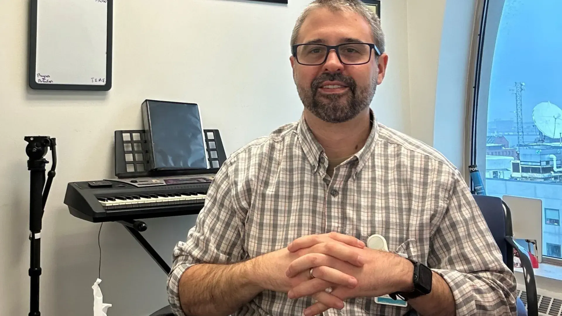 man sitting in front of his keyboard