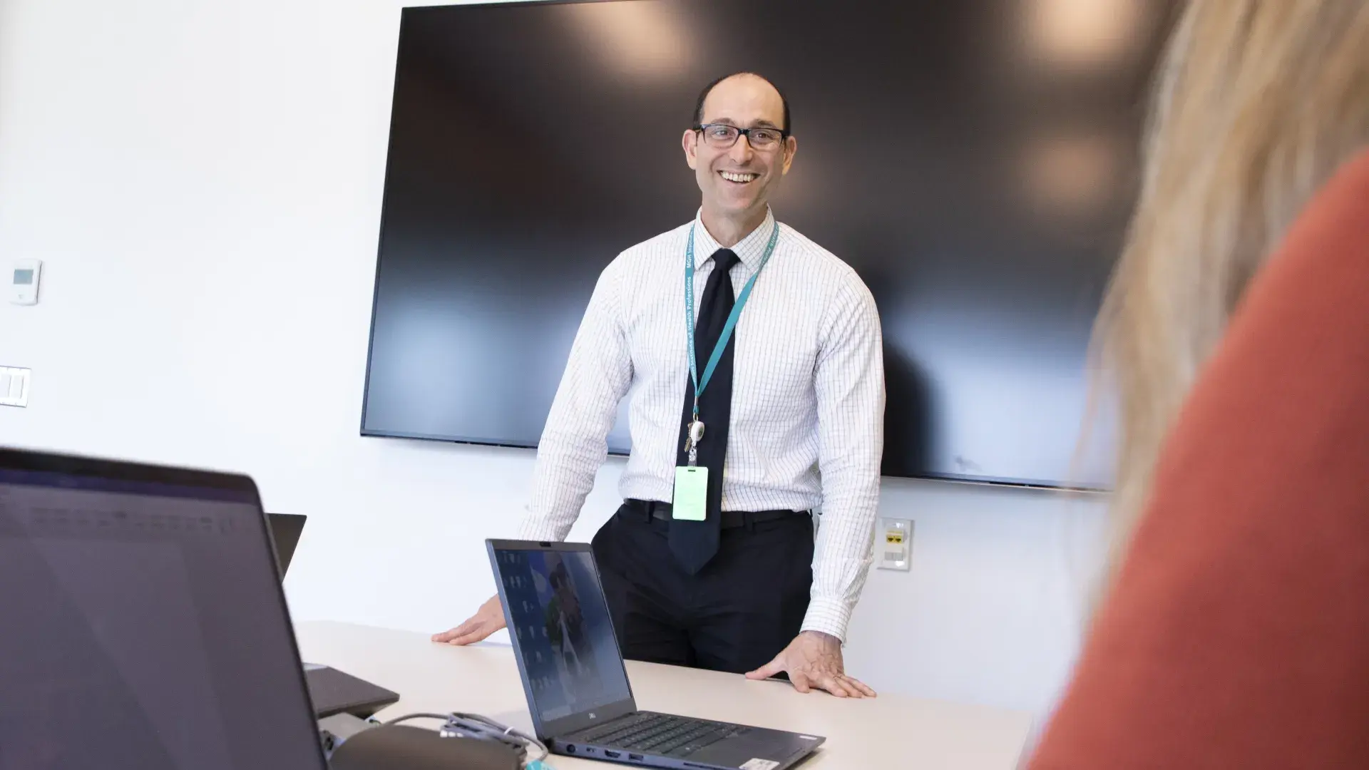 man standing and smiling 