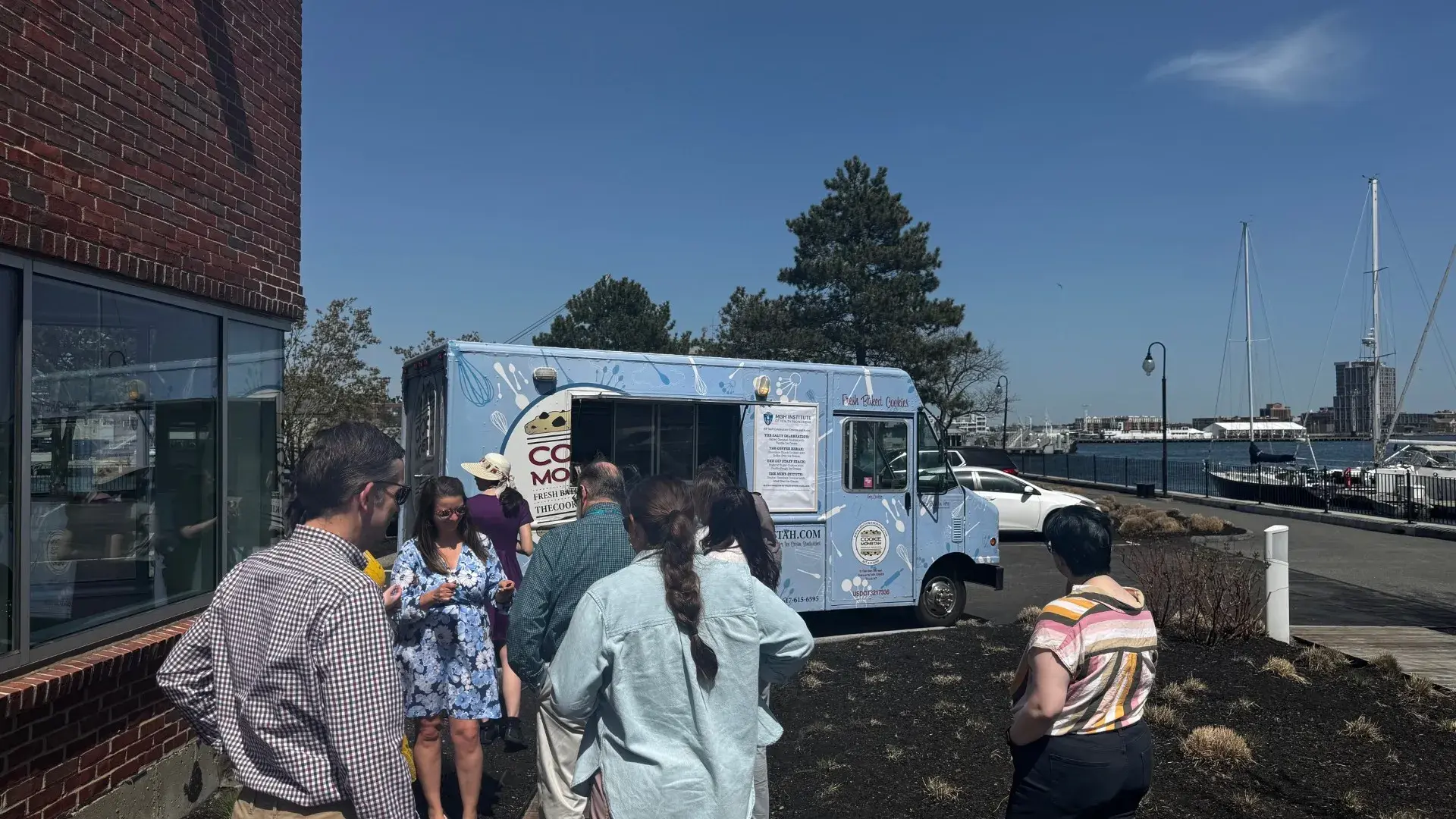 People standing in line in front of food truck
