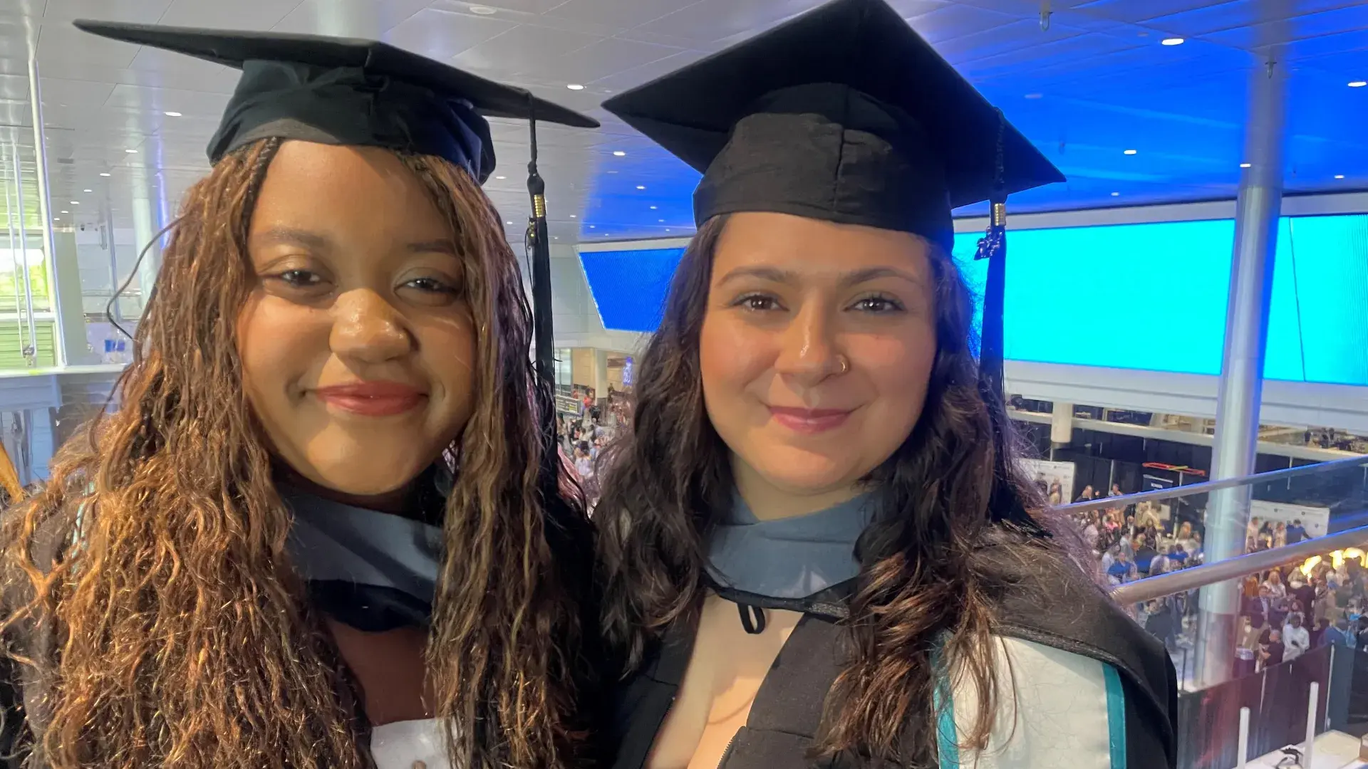 two women in cap and gown 