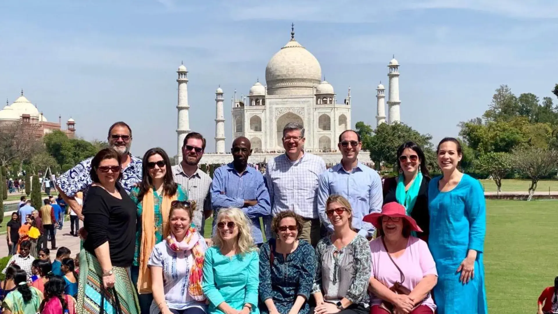 A group poses in front of the Taj Mahal