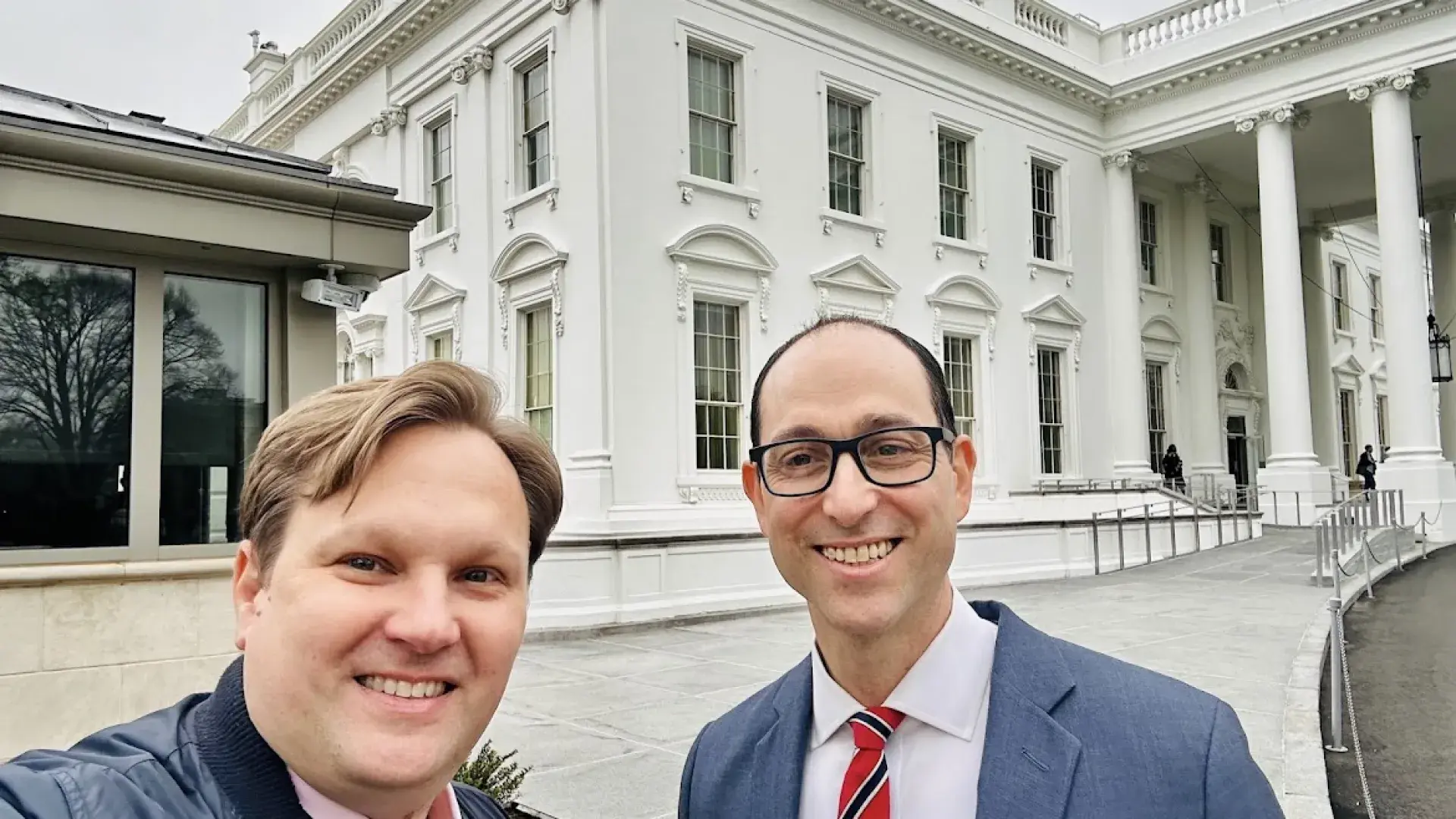 Two men in front of the White House