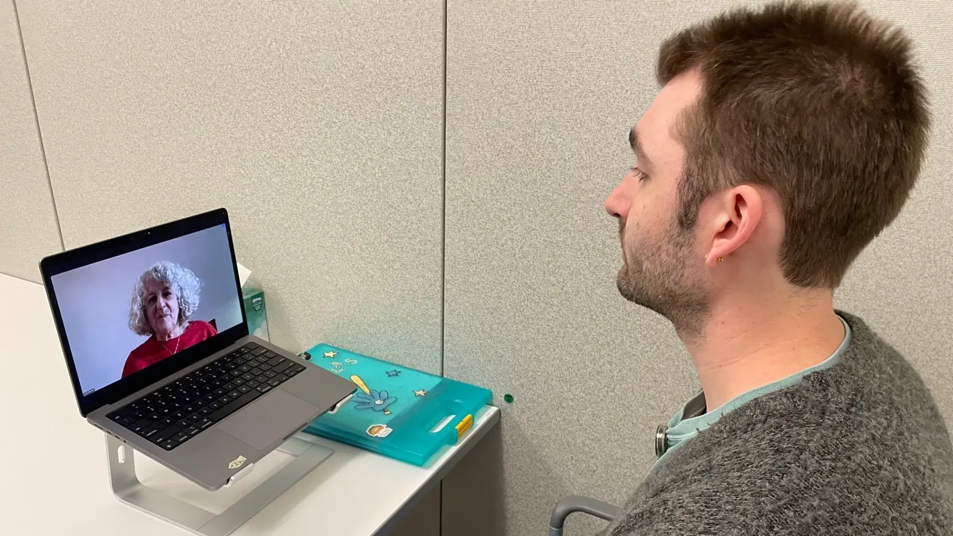 Man talking to woman via computer 