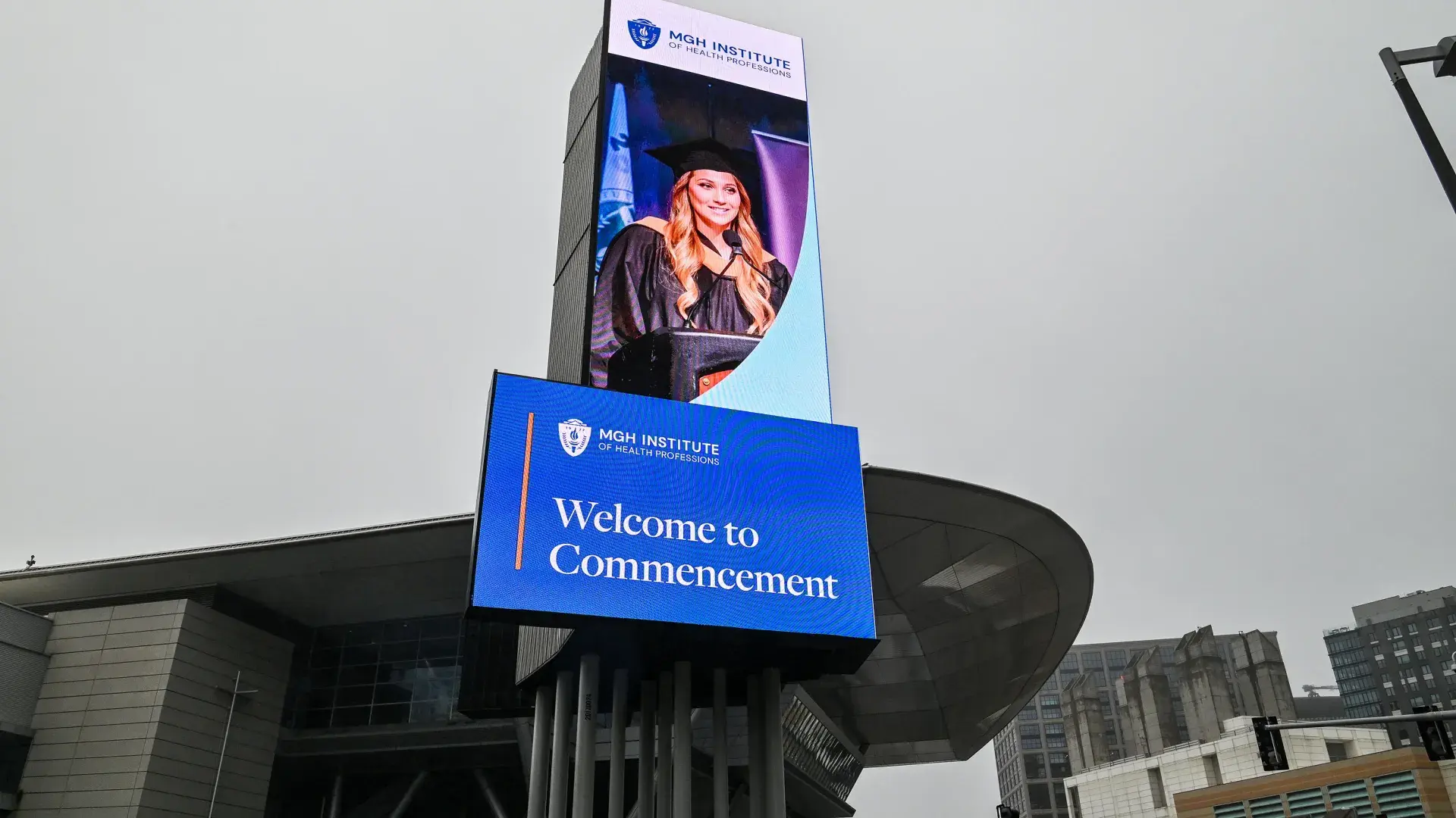 A billboard with the words Welcome to Commencement