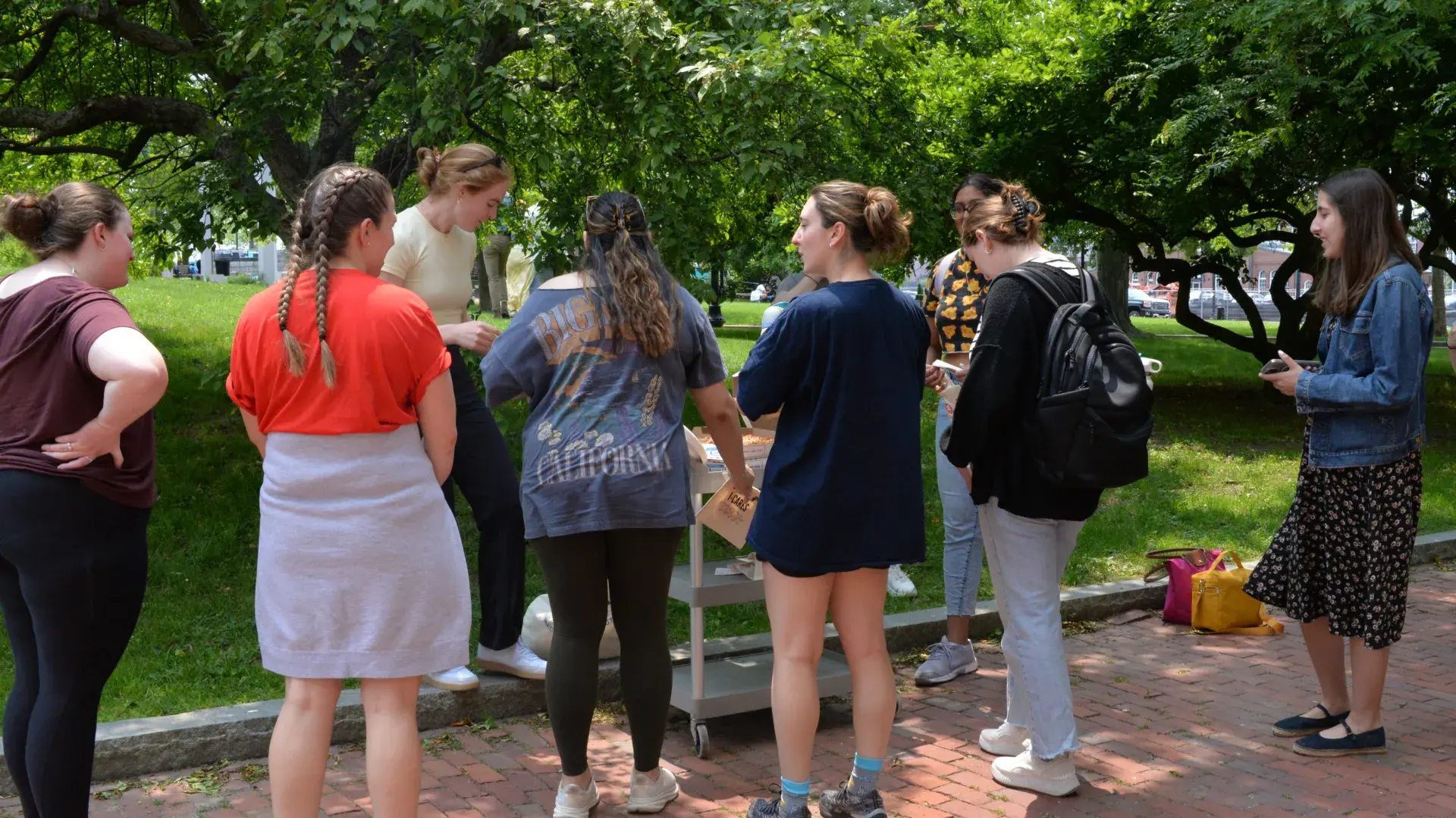 A photo of people gathered at an event outdoors