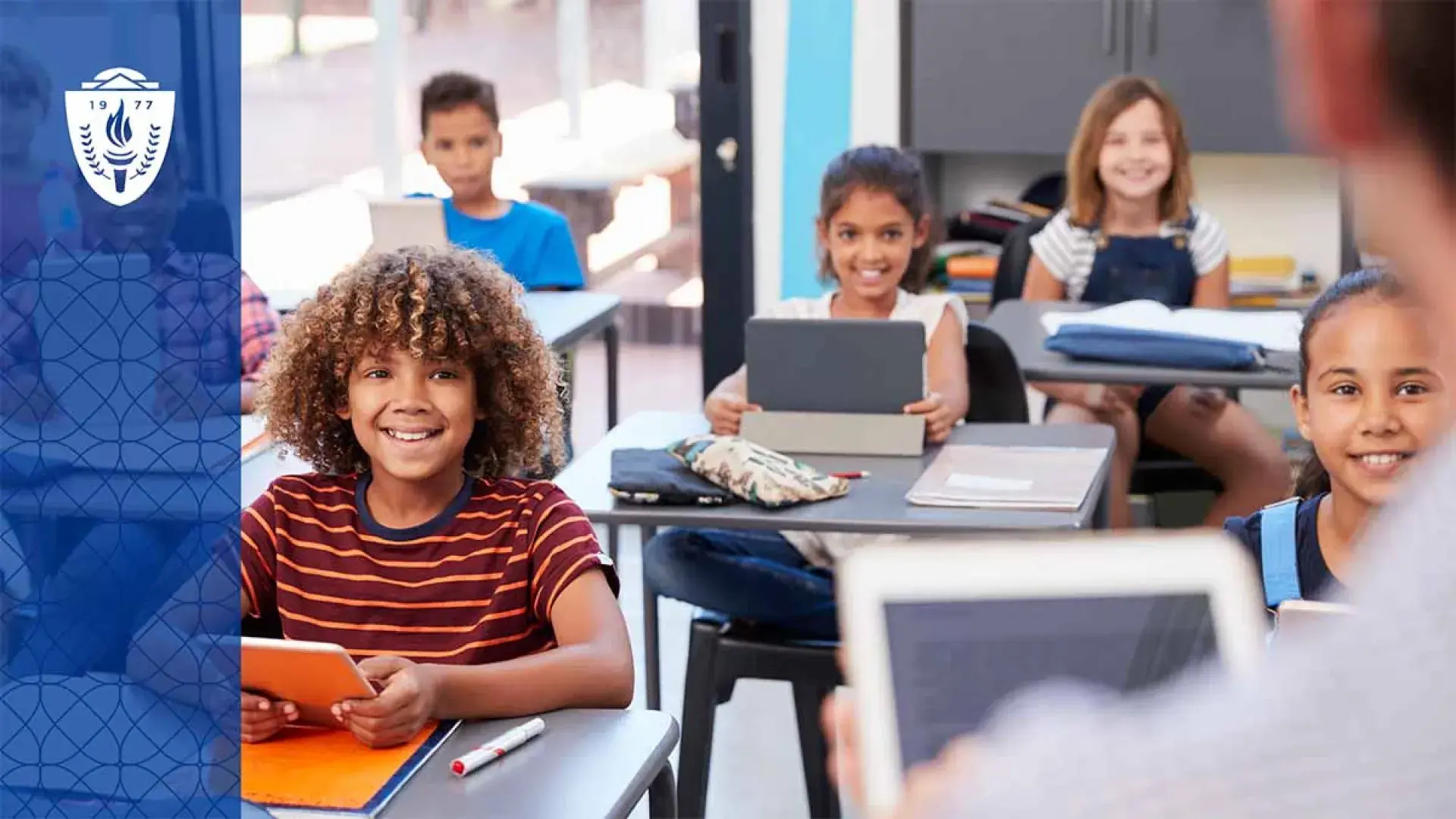 Young kids sitting at desk in a classroom