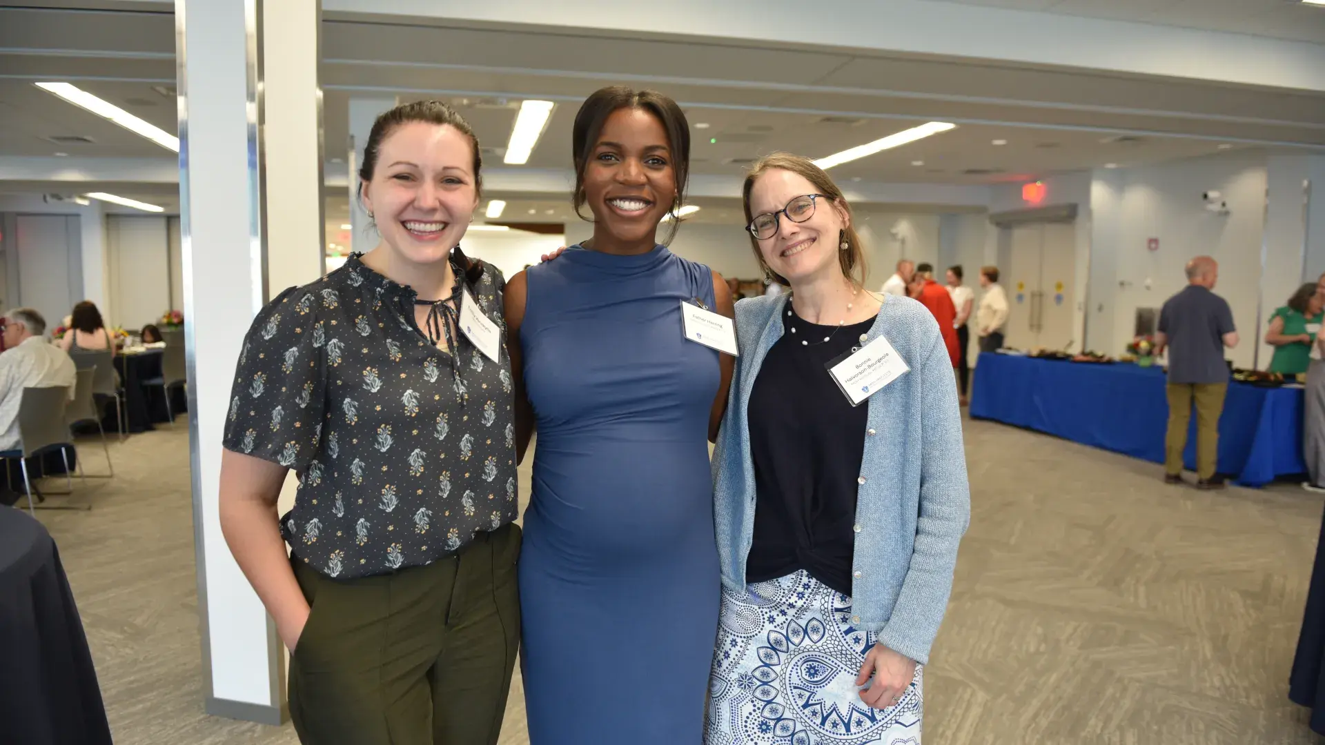 A photo of a group of three women