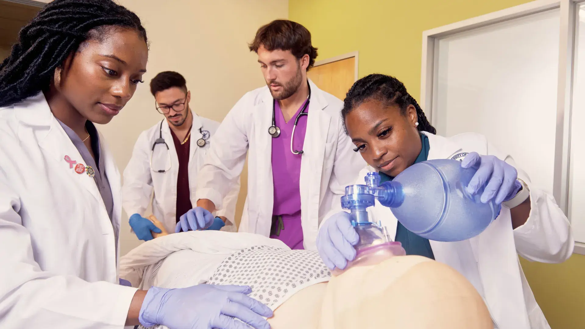 med school students around bed